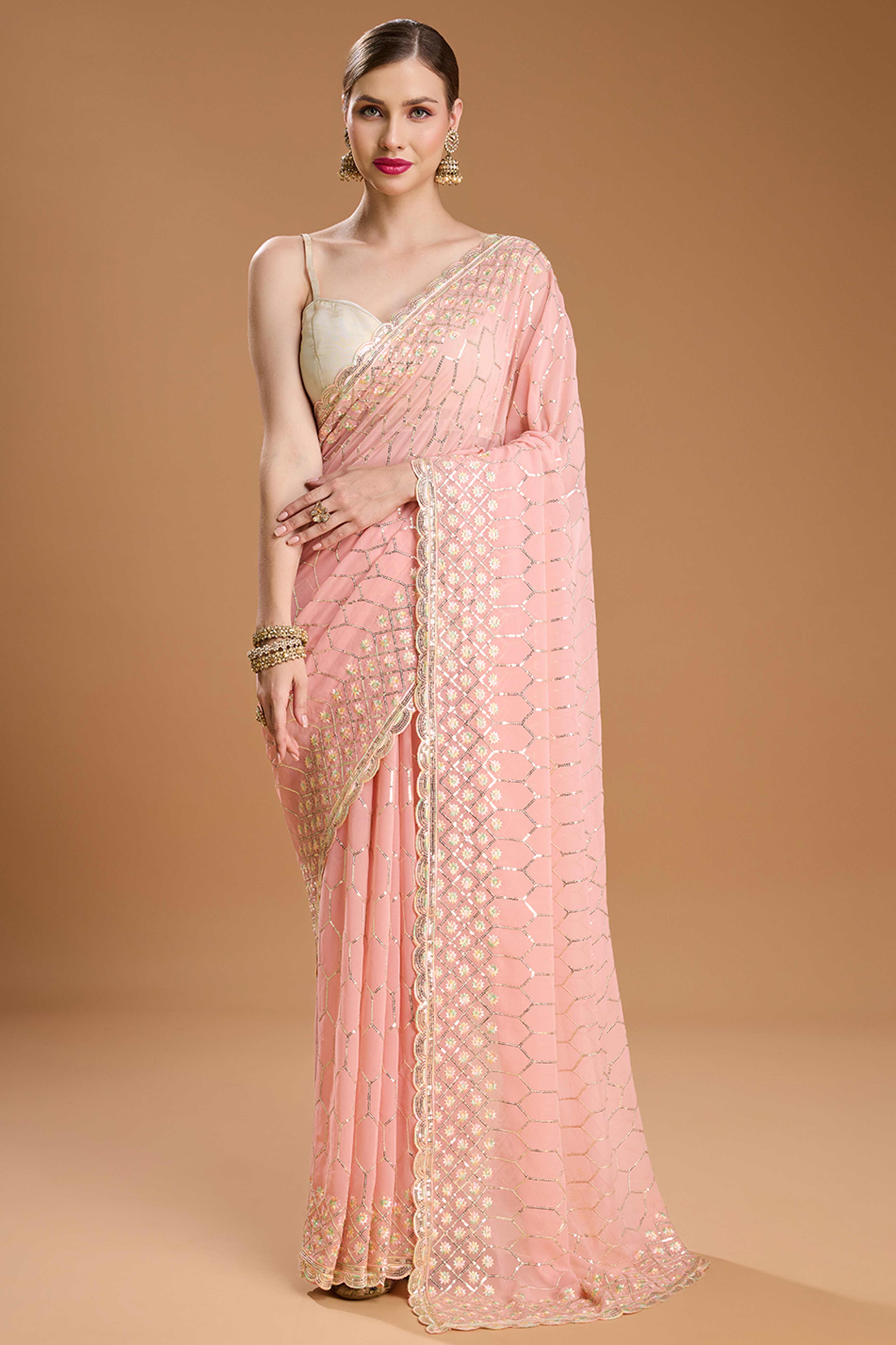 Pastel Peach Georgette Saree Enhanced with Elegant Sequins Embellishments