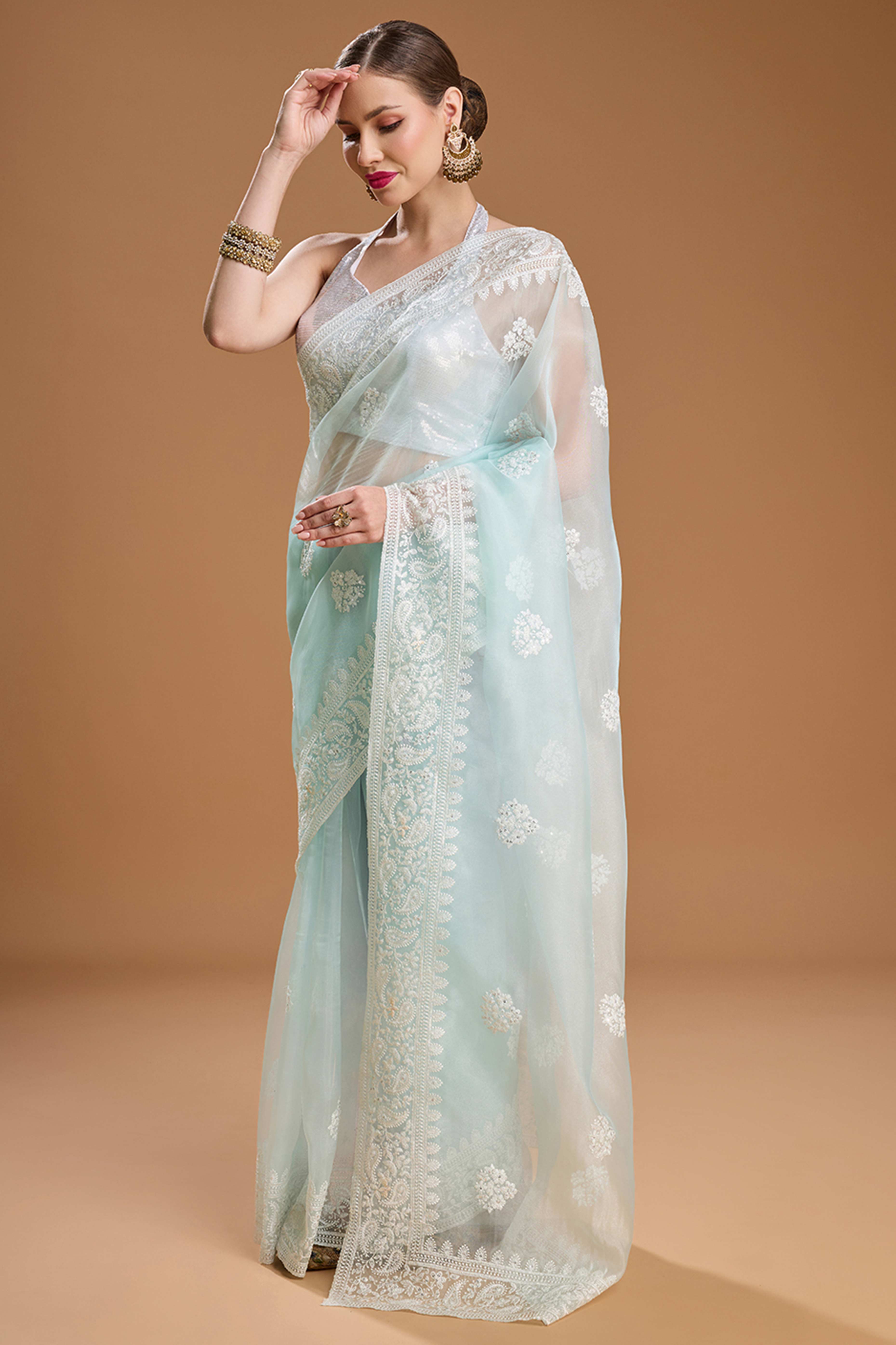 Mint Green Net Saree Enhanced with Elegant Sequins Embellishments