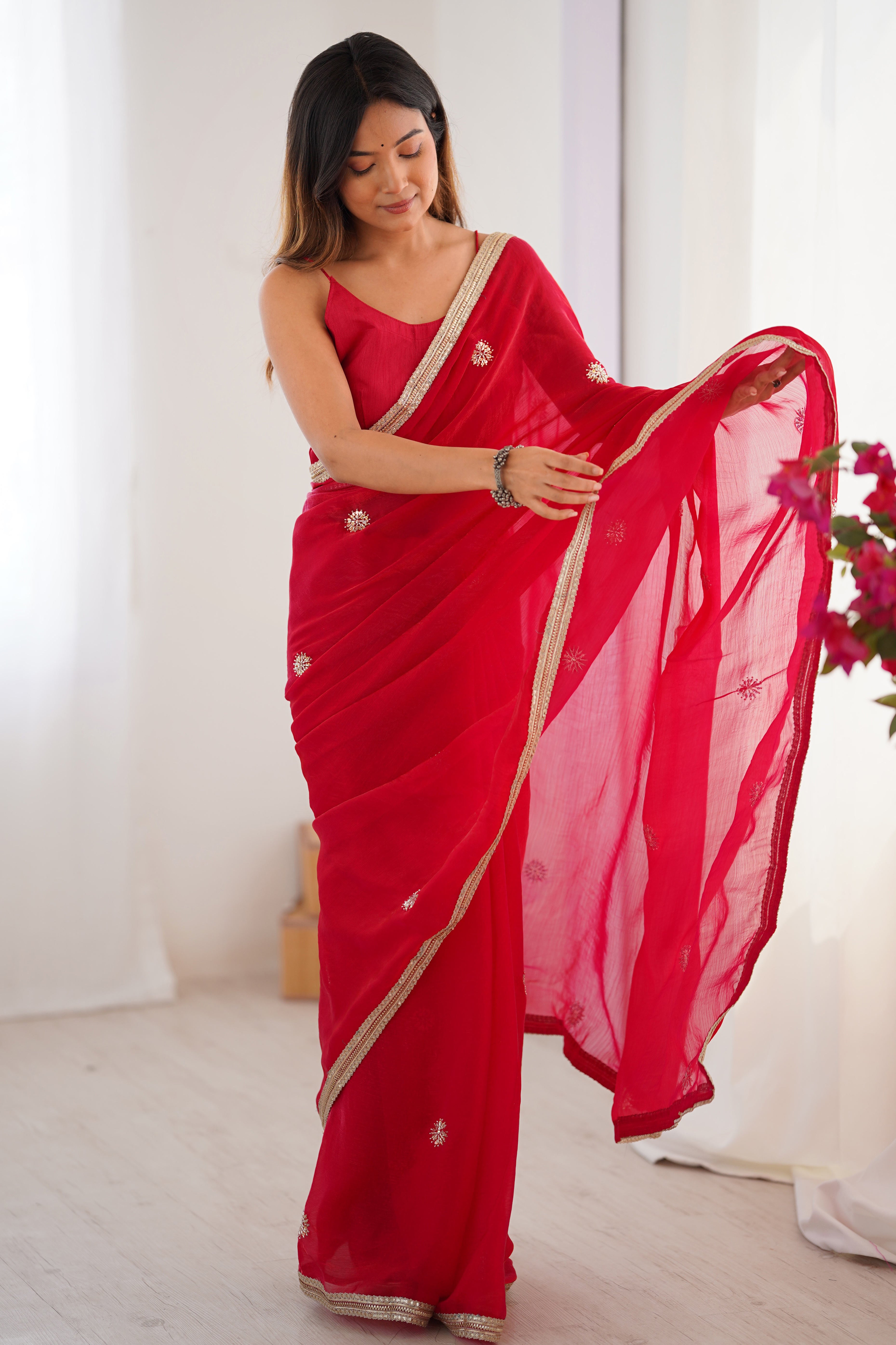 Elegant Red Organza Saree with Delicate Floral Embellishments and Lace Border