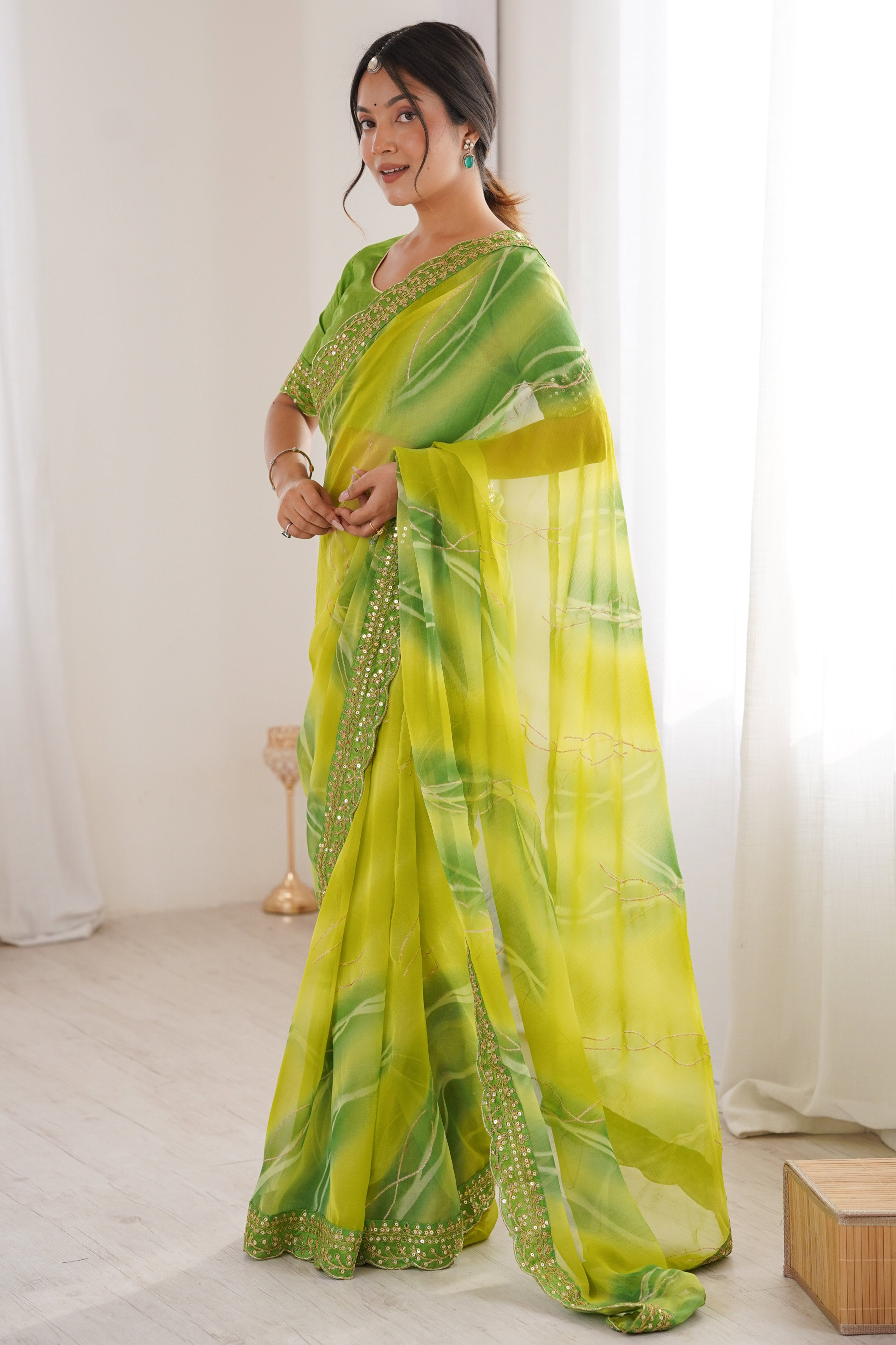 Graceful Green Foil Print Georgette Saree Featuring A Luxurious Cording Sequins Embroidered Border