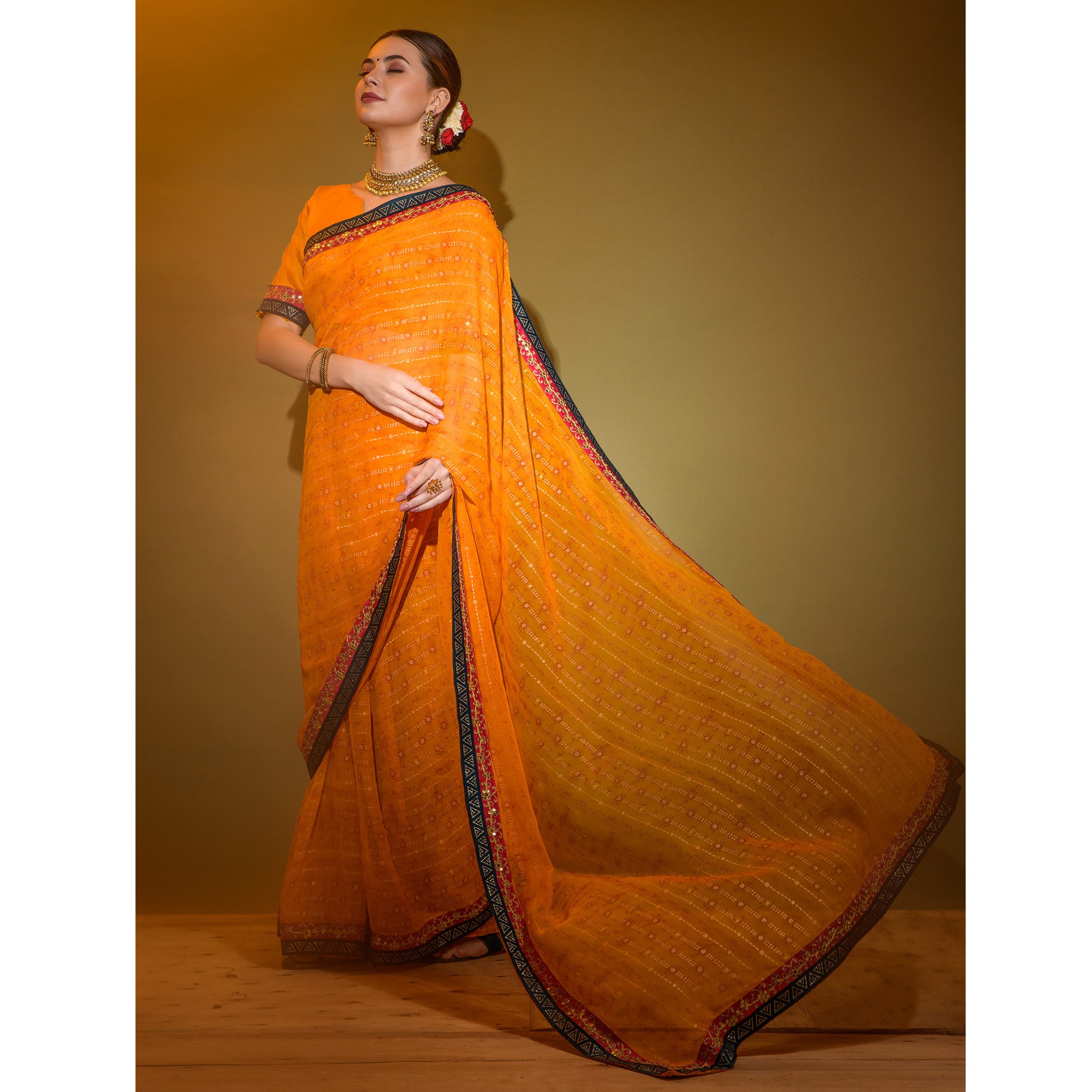 Orange Foil Printed Georgette Saree With Embroidered Border