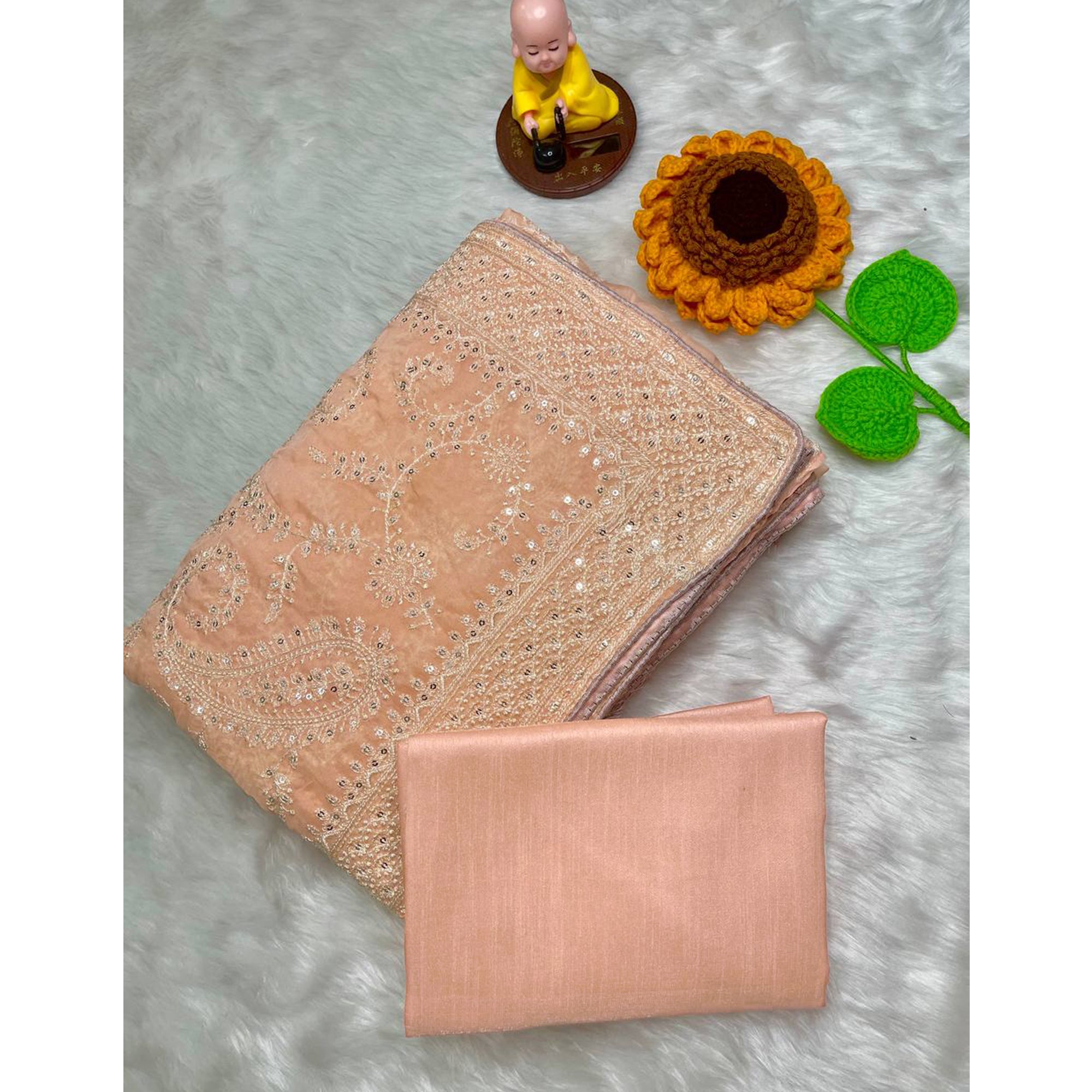 Lustrous Light Orange Organza Silk Saree Beautified With Paisley Embroidery & Glittering Sequins