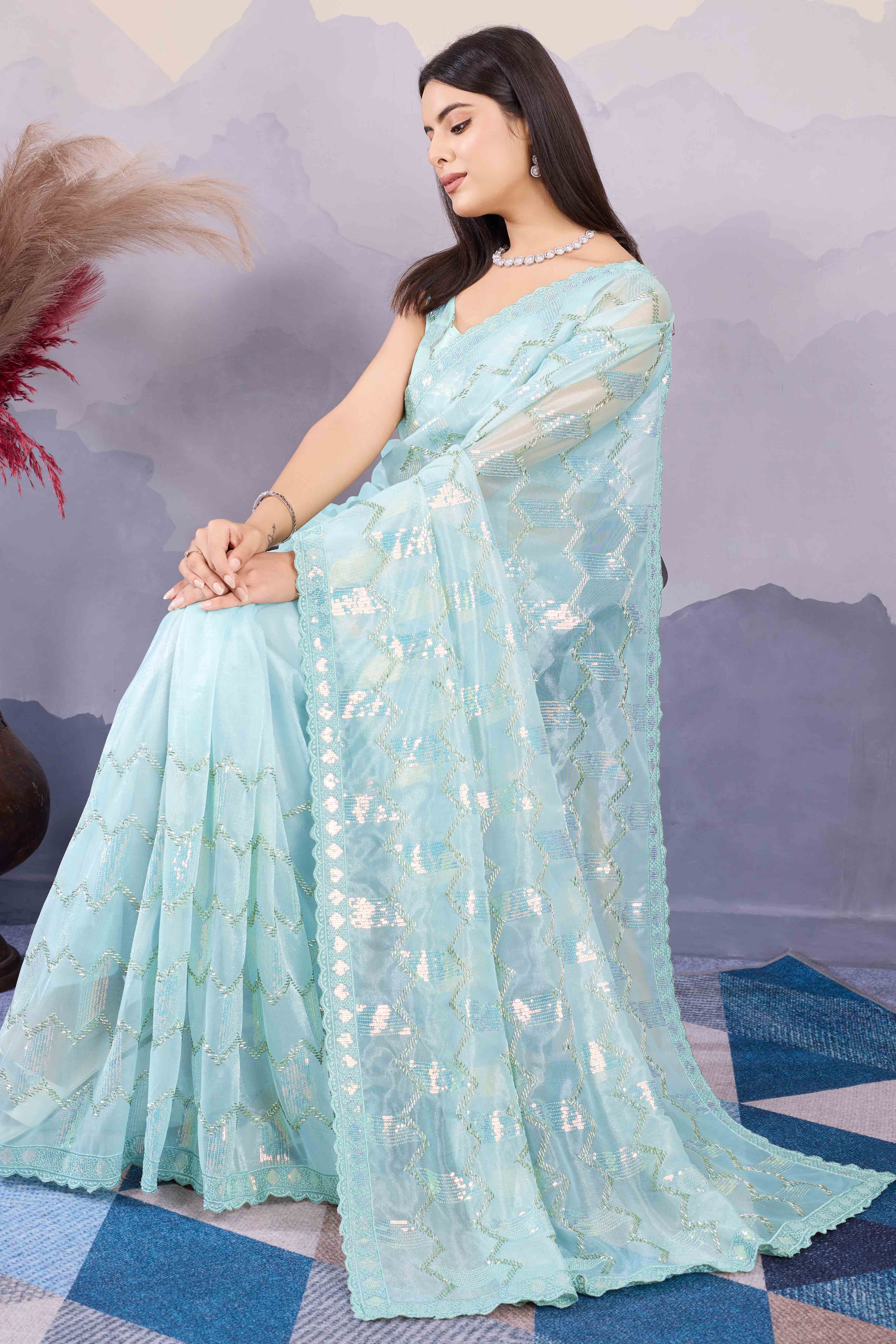 Light Turquoise Sequins Embroidered Twill Net Saree