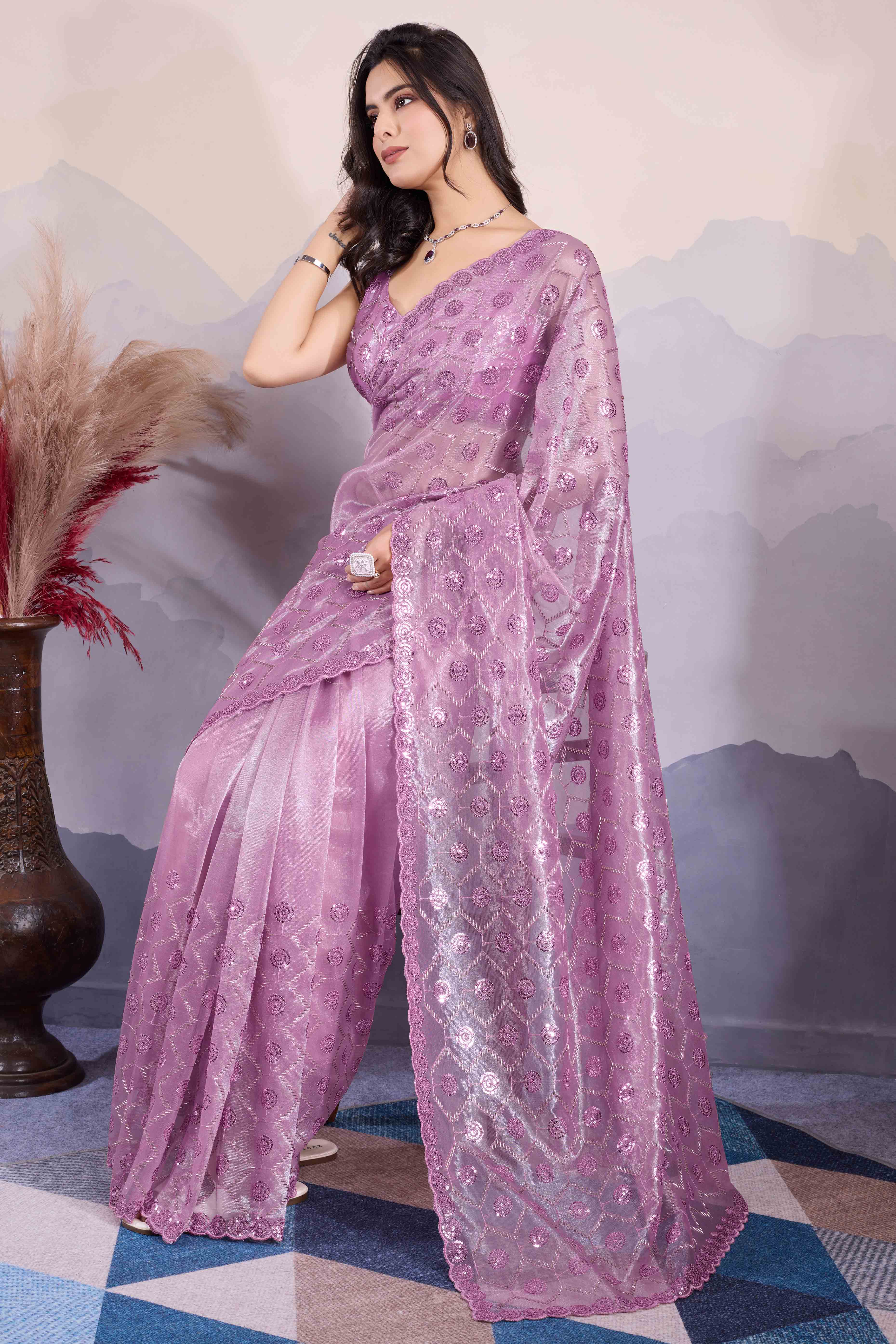 Mauve Sequins Embroidered Twill Net Saree