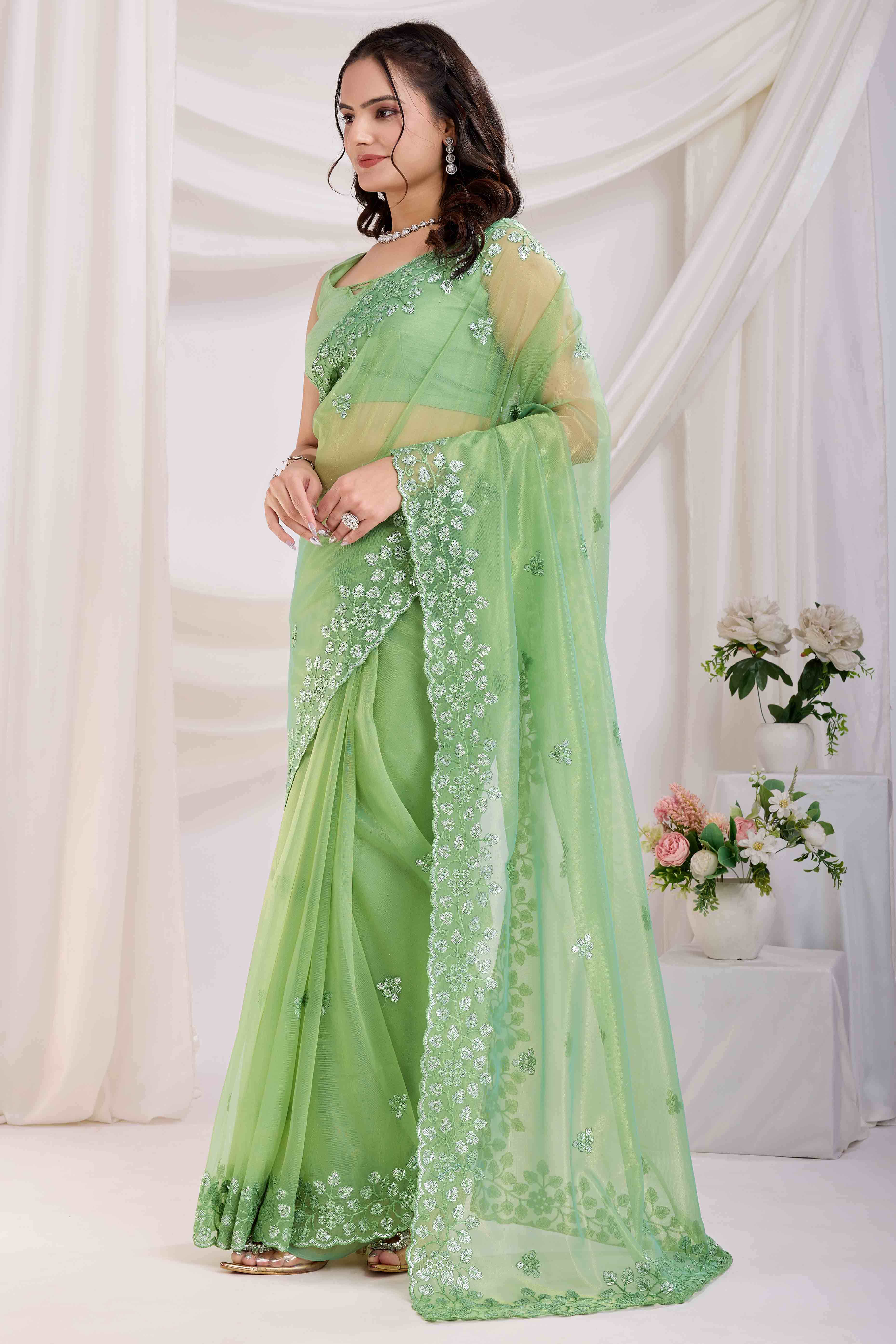 Green Twill Net Saree Embellished With Sequin Floral Embroidery