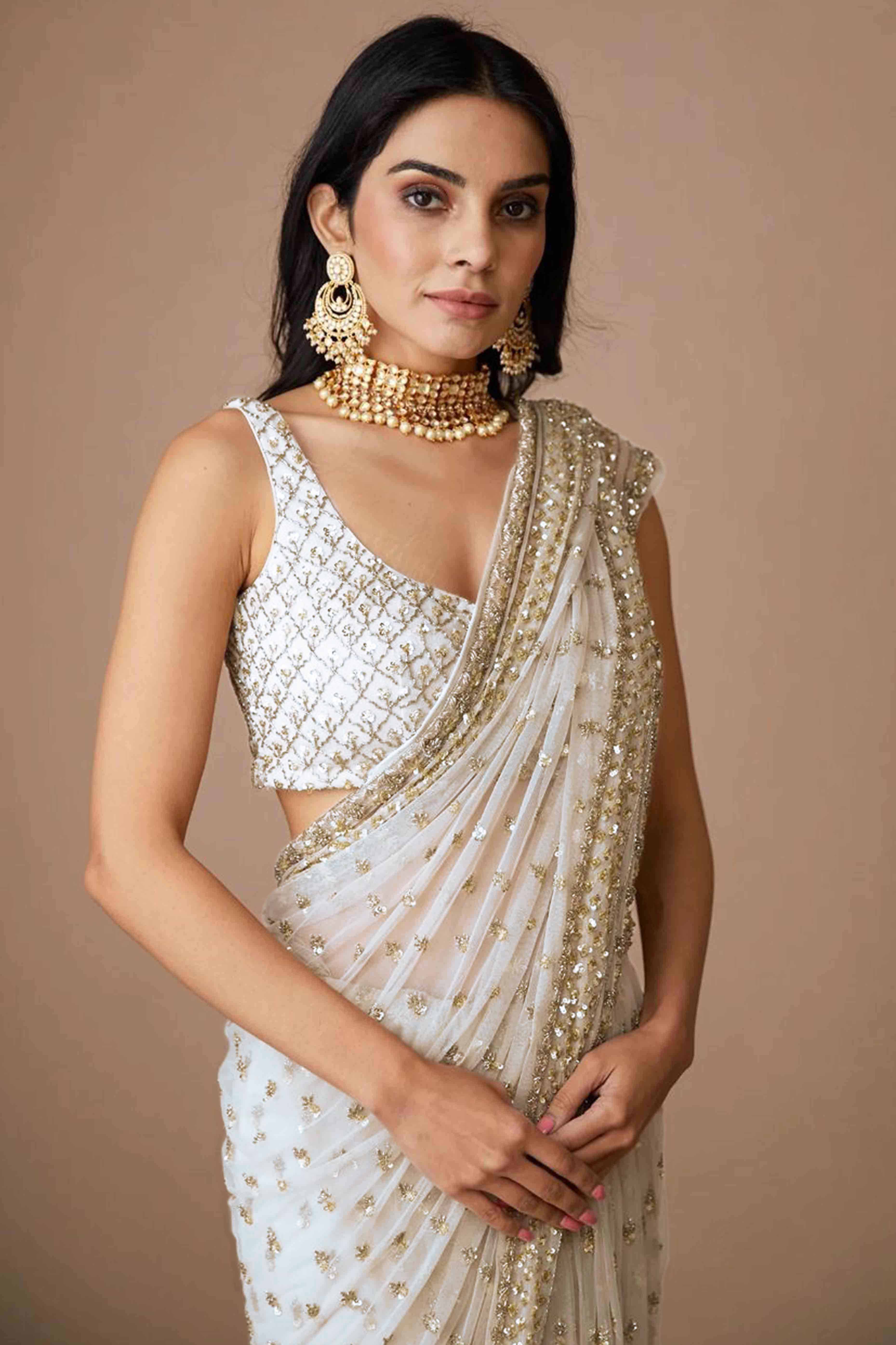 Graceful Off White Sequins Embellished Net Saree for Partywear