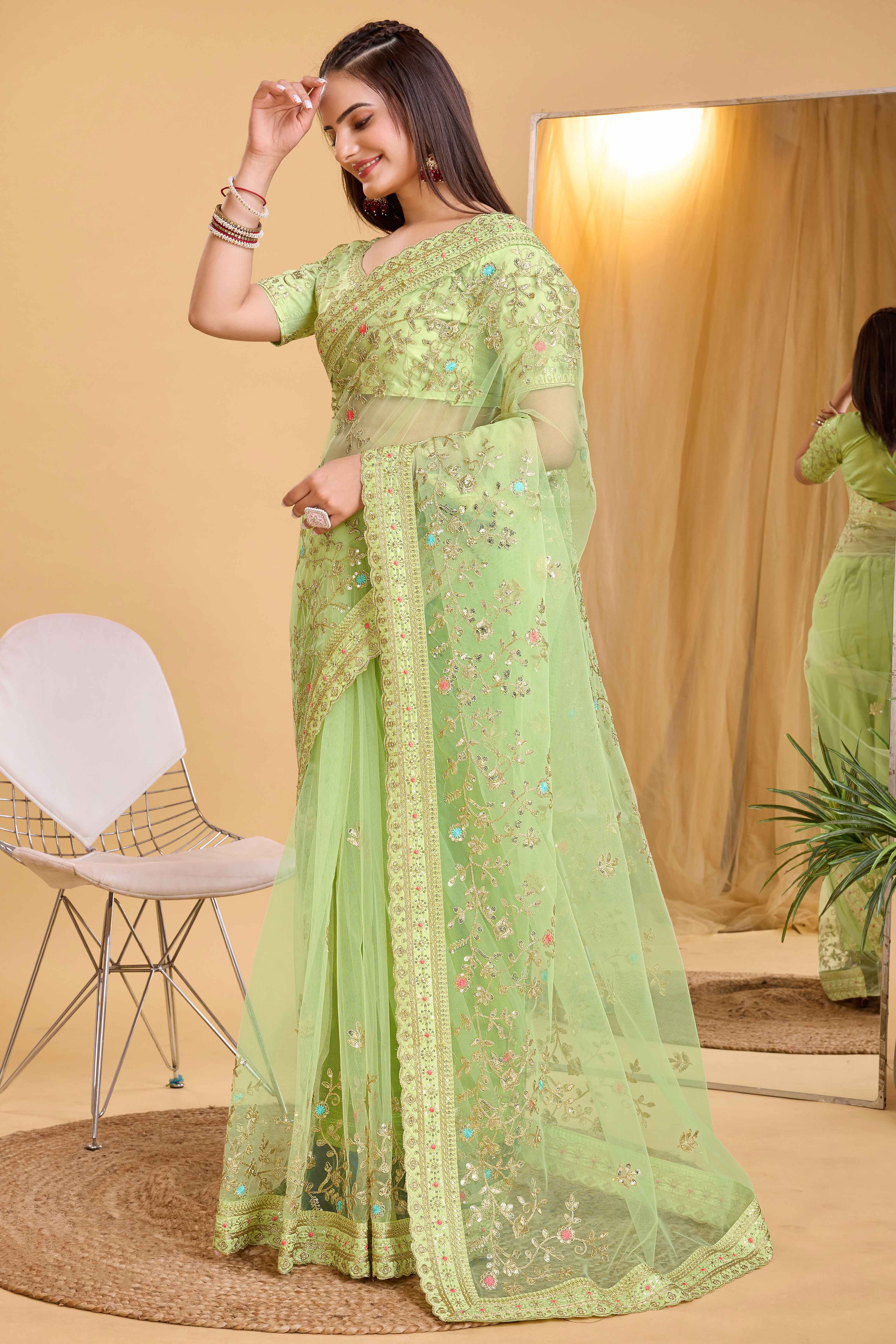 Green Soft Net Saree With Delicate Floral Embroidery & Shimmering Sequins Work