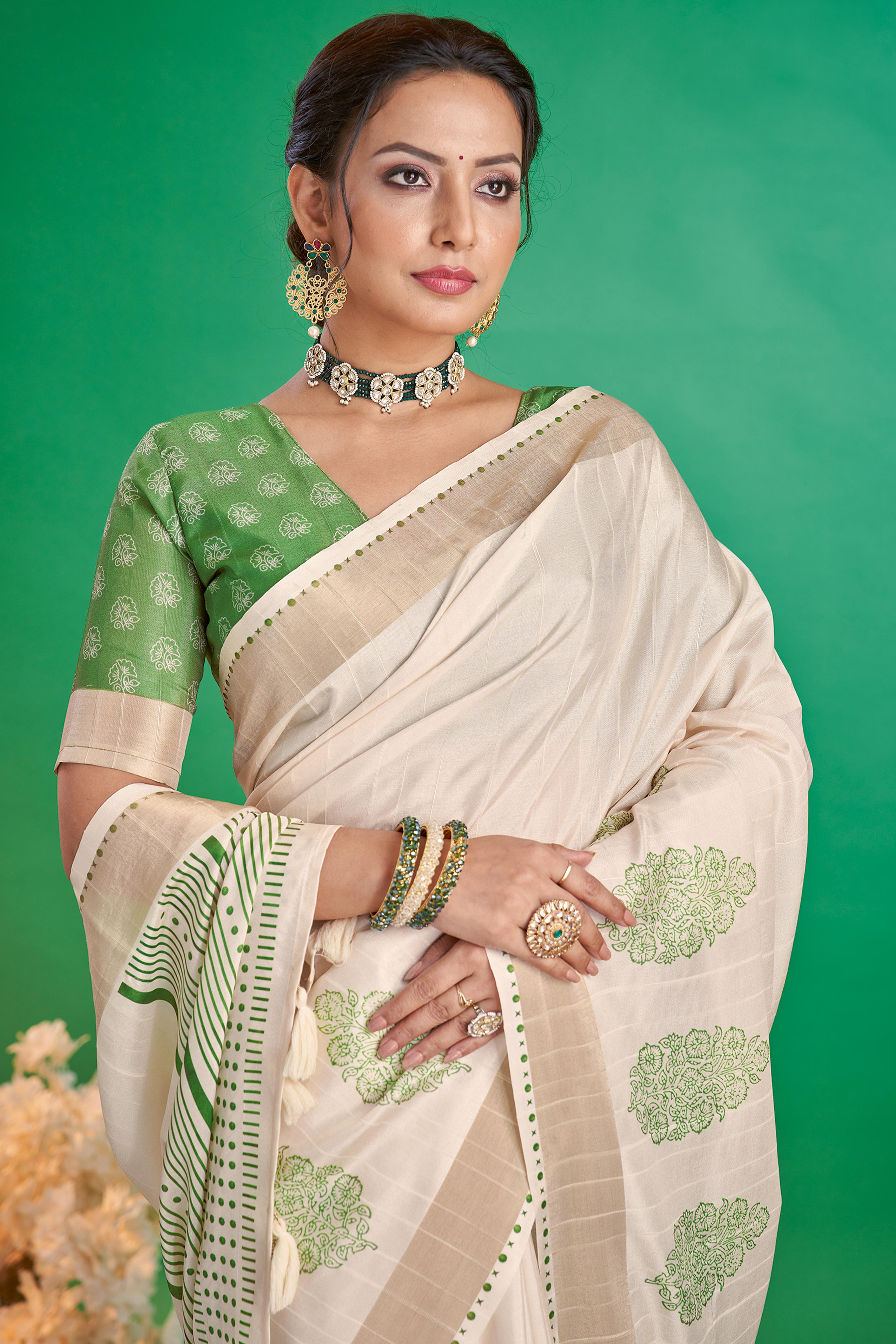 Charming Offwhite & Green Floral Printed Kotha Cotton Silk Saree Adorned With Graceful Tassel Pallu
