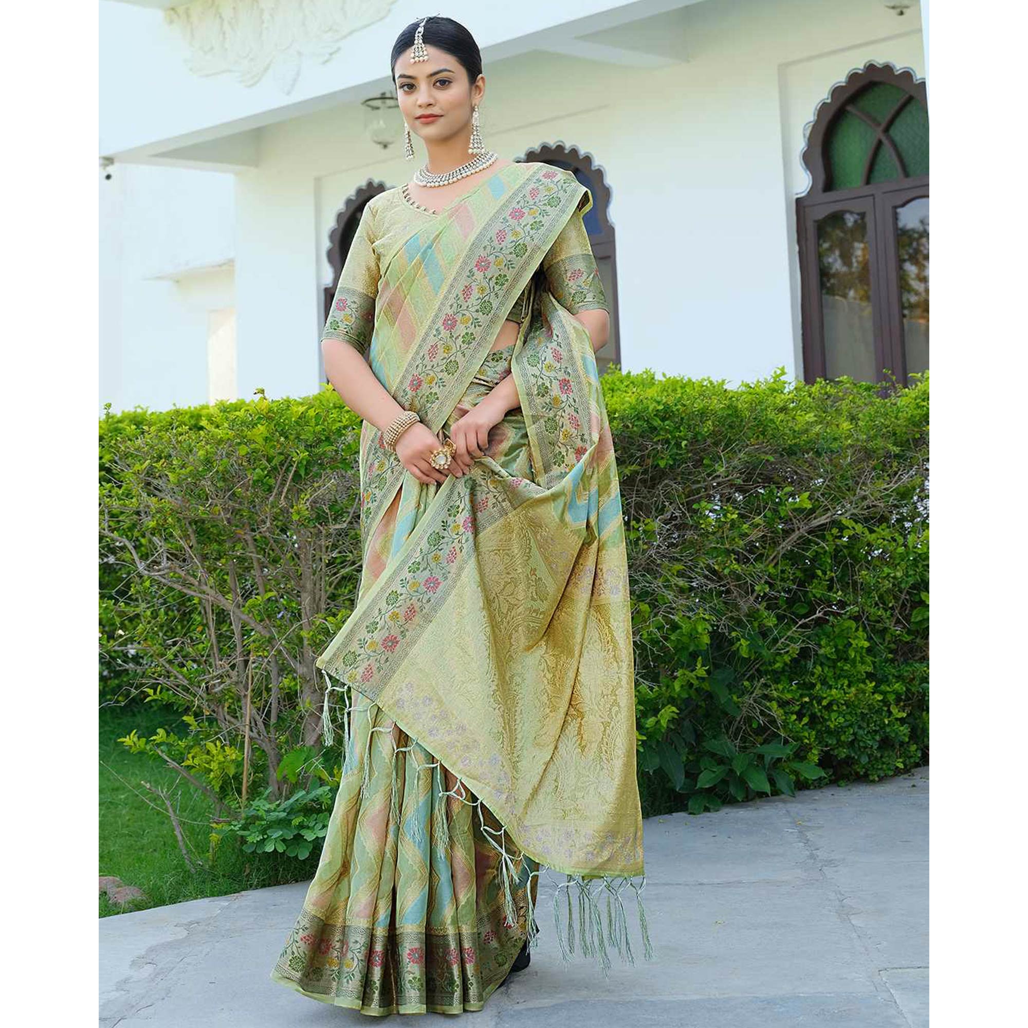 Green Woven Organza Saree With Tassels