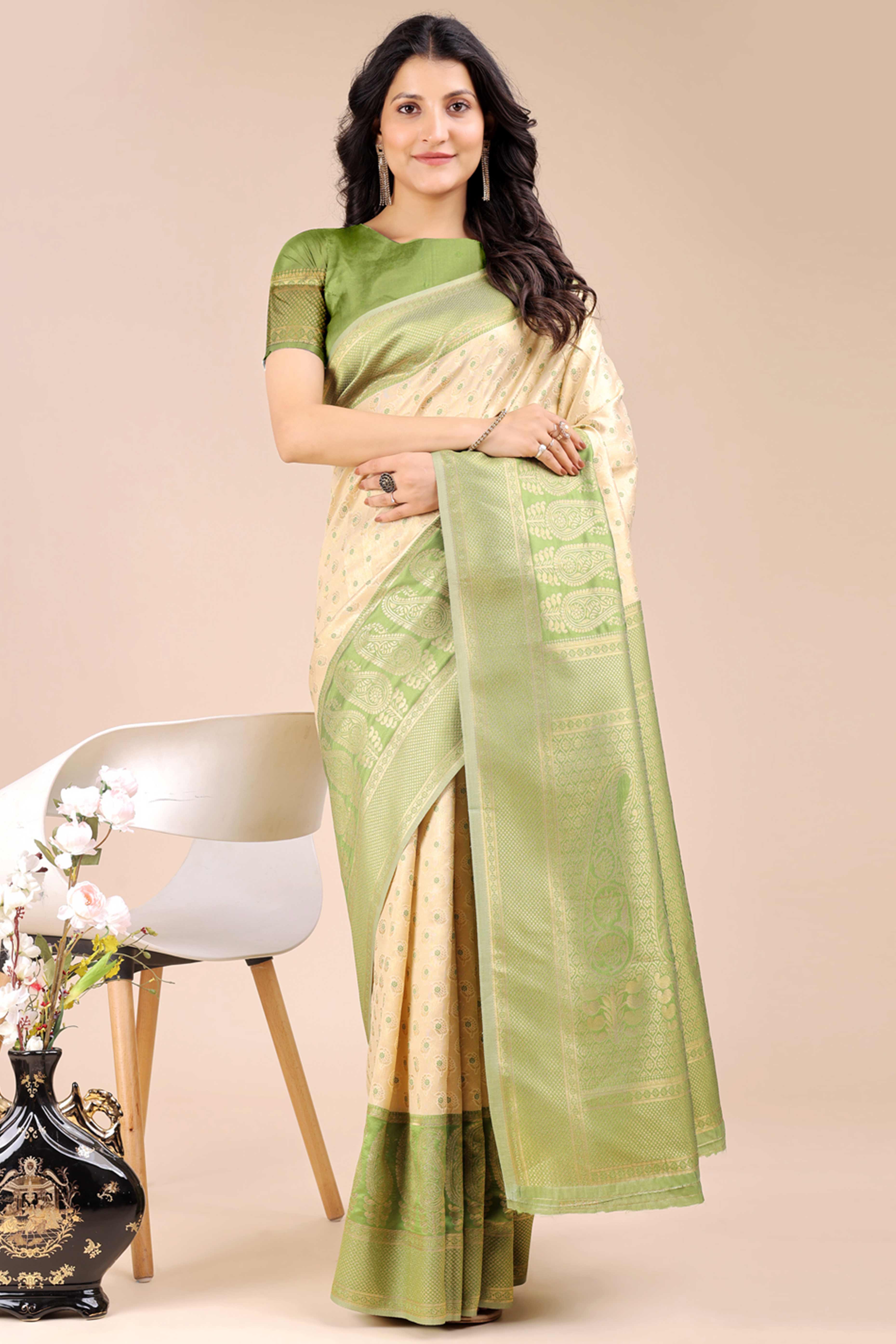 Cream Banarasi Silk Saree Featuring Lustrous Light Green Floral Zari Weaving and a Rich Contrast Border