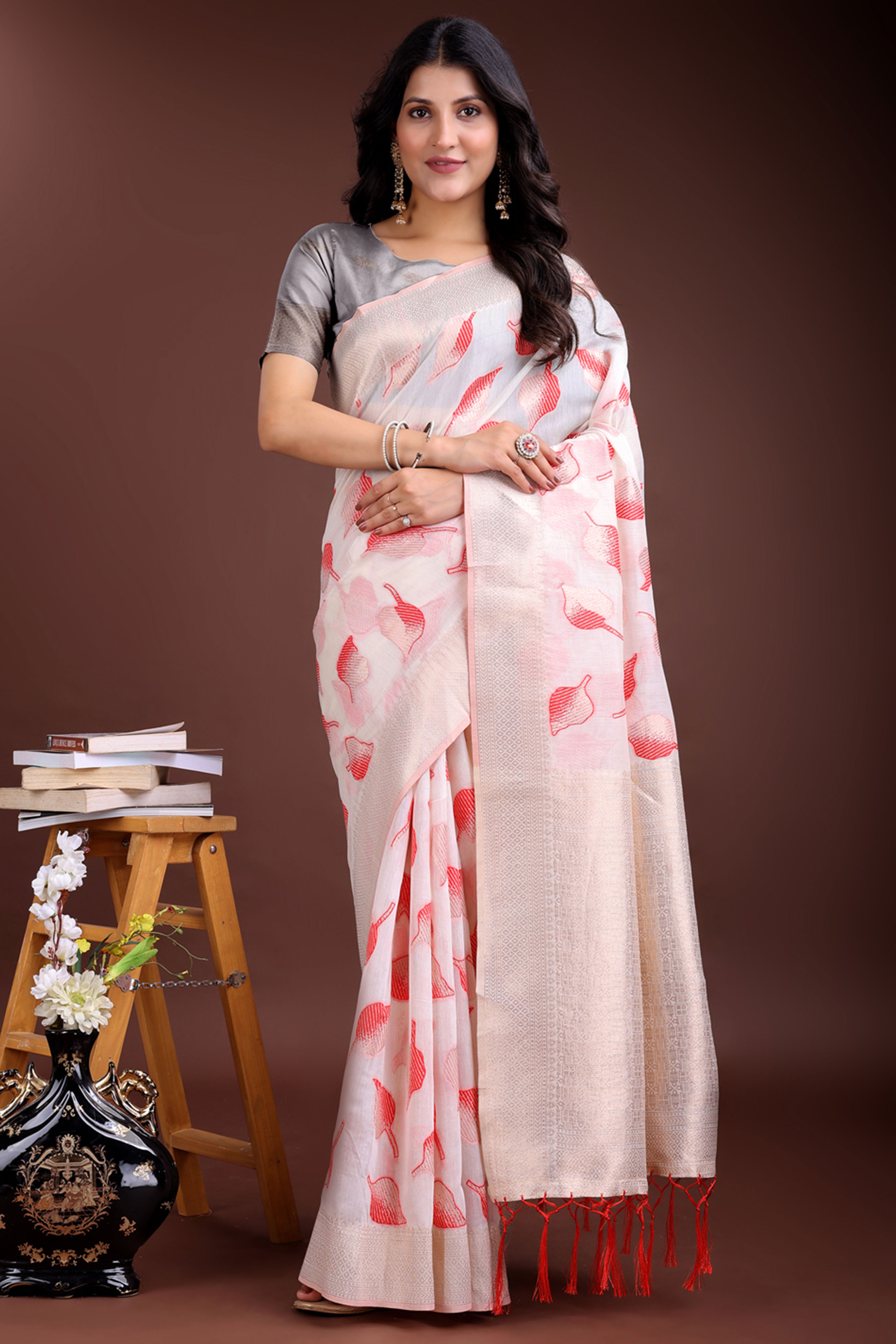 White and Red Cotton Silk Saree with Leaf Motifs and Zari Border Tassel Artistry