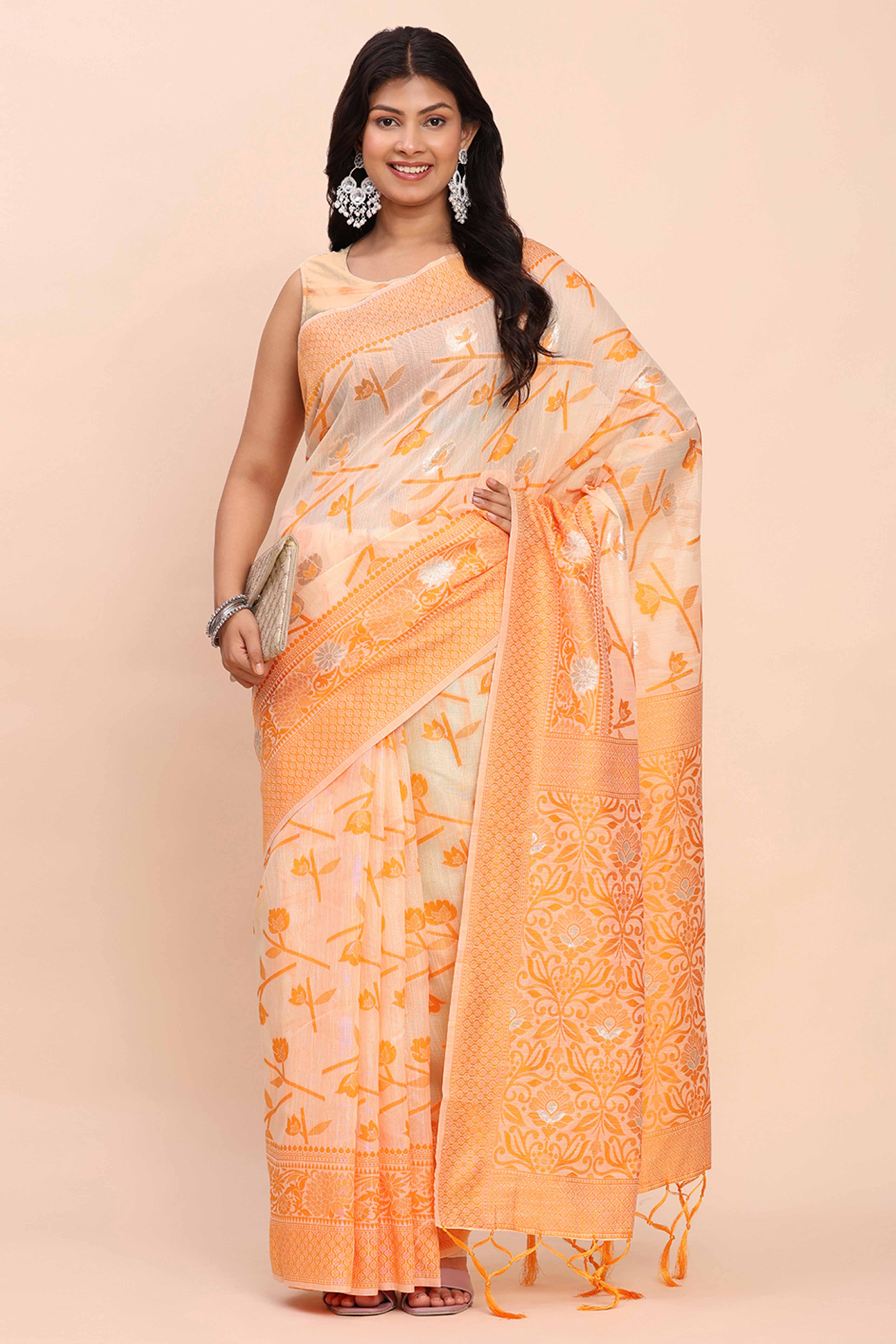 Orange Floral Linen Cotton Saree Accented With Zari Weaving & Tassel Pallu Elegance