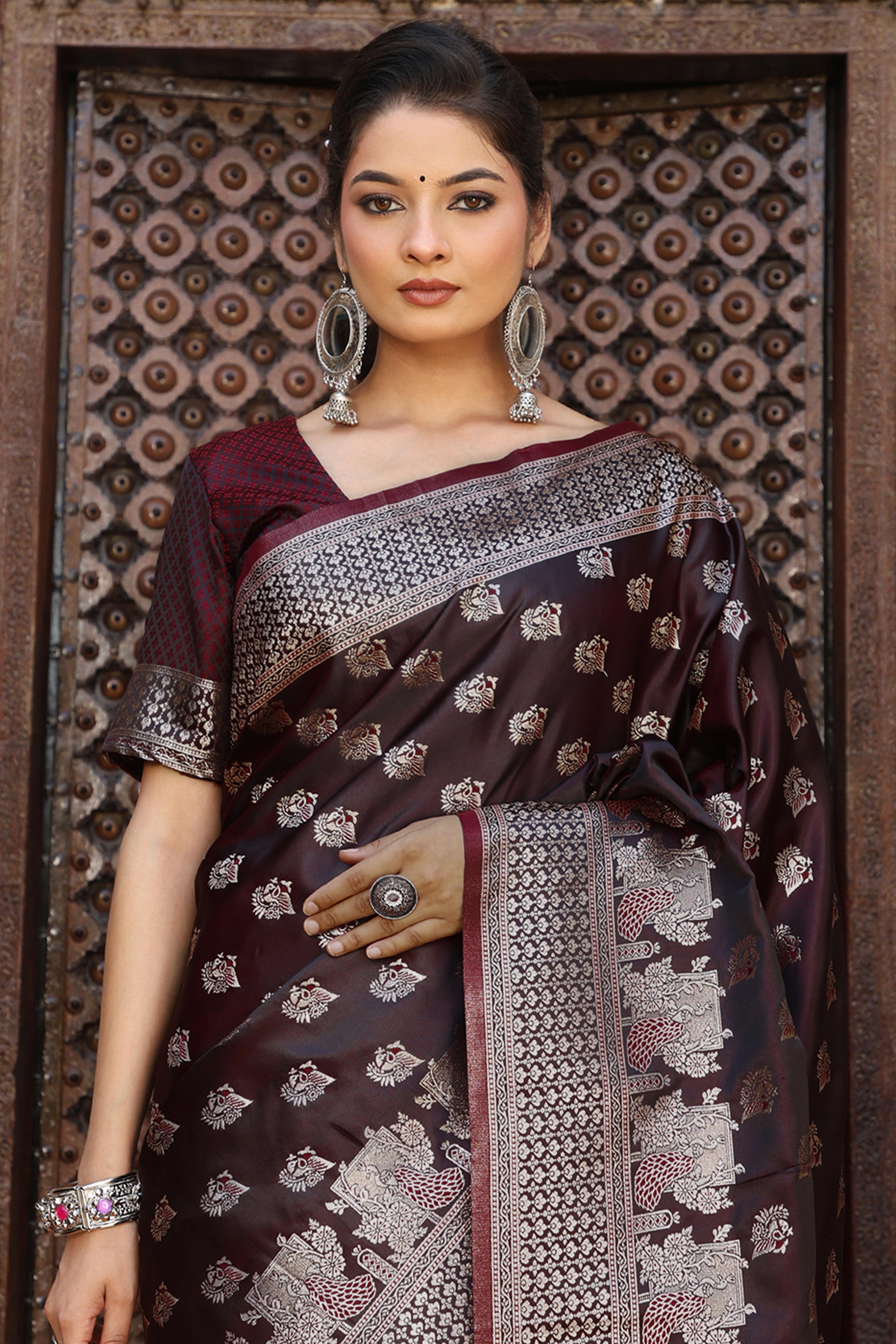 Designer Dark Maroon Saree Showcasing Peacock & Floral Zari Weaving With Handmade Tassel Pallu