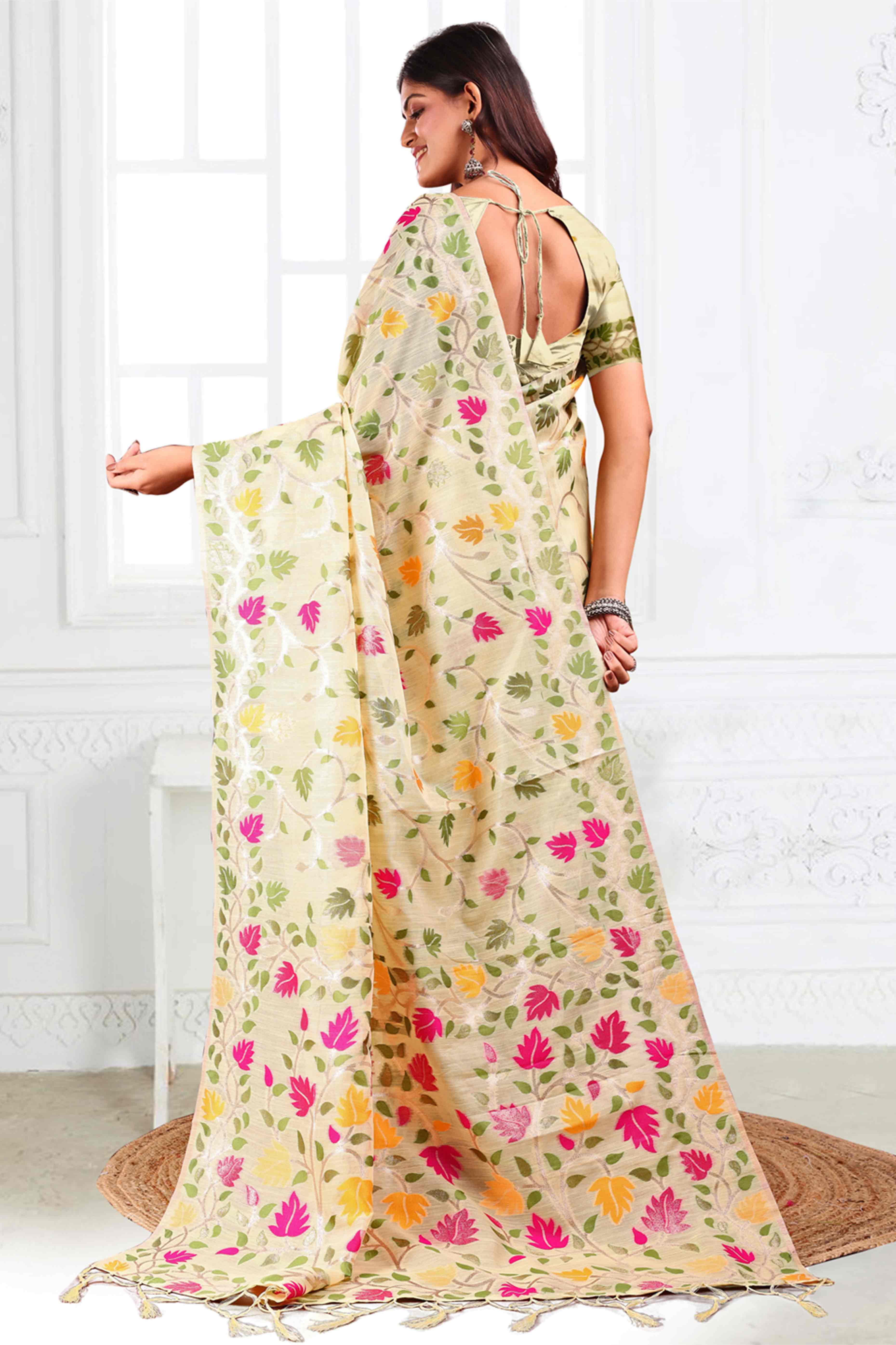 Cream Linen Cotton Silk  Saree Enhanced With Floral Zari Weaving & Tasselled Pallu Finish