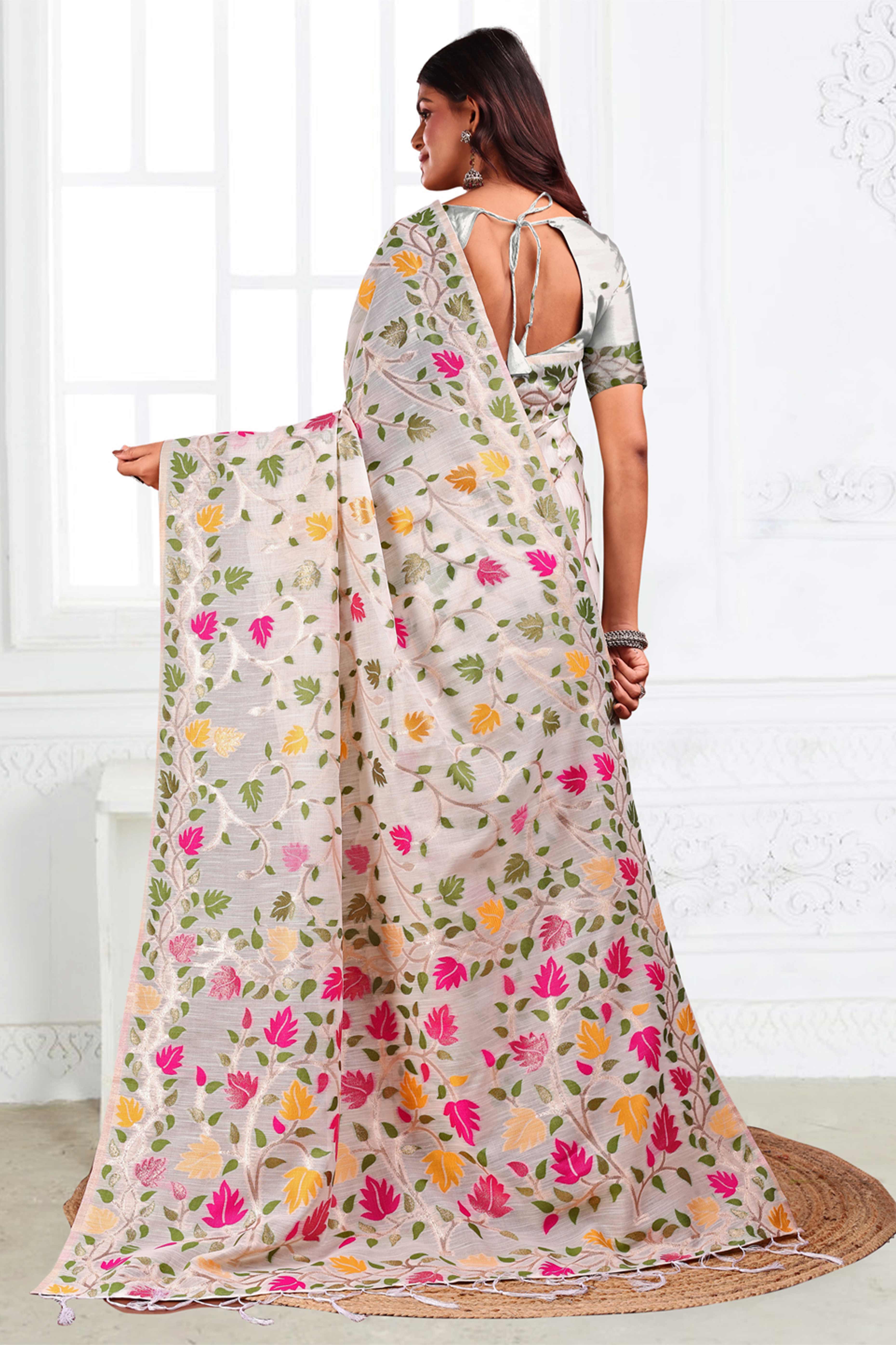 White Linen Cotton Silk  Saree Enhanced With Floral Zari Weaving & Tasselled Pallu Finish