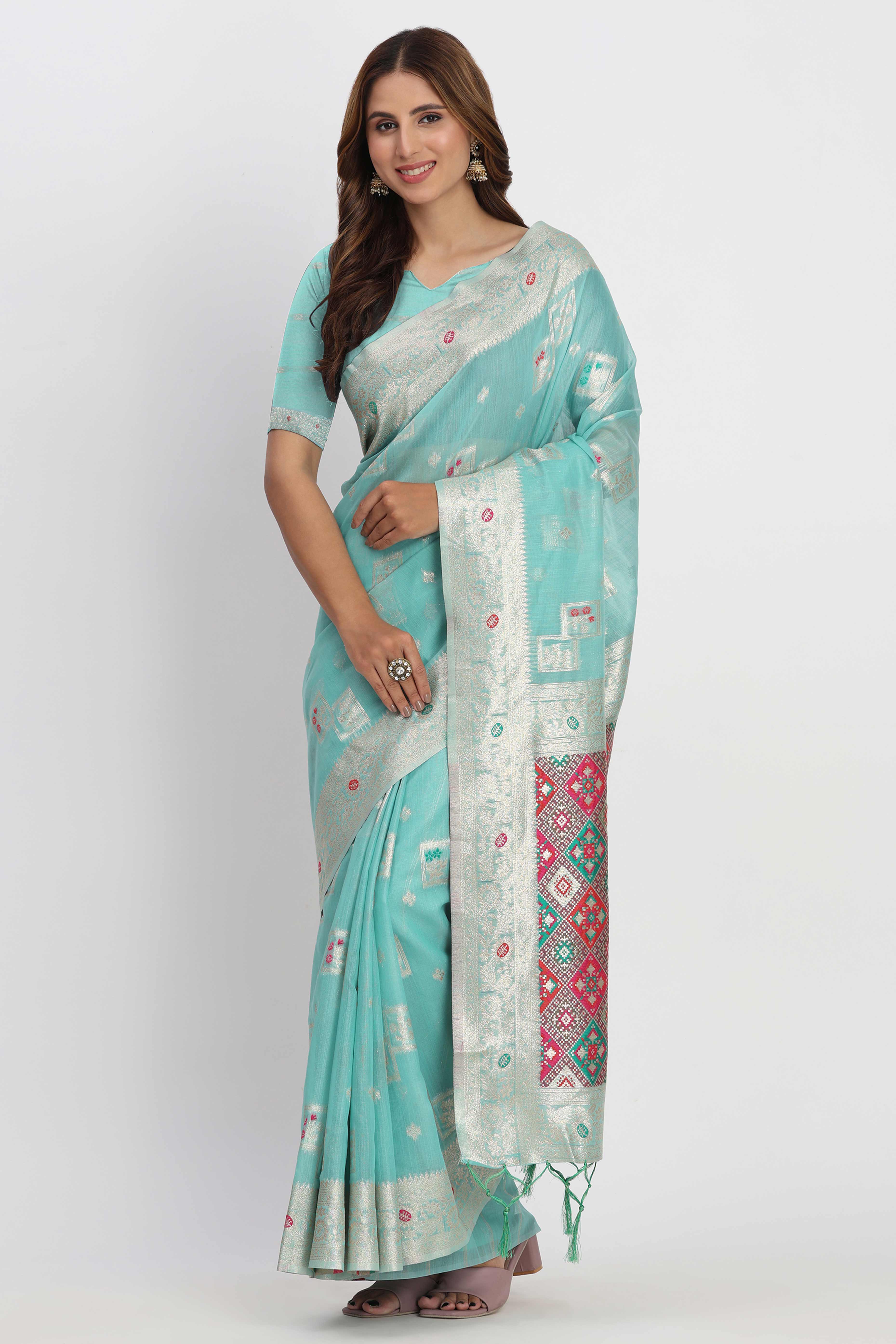 Floral Zari Weaving Brings Regal Beauty To This Turquoise Linen Cotton Saree With Tassel Accents