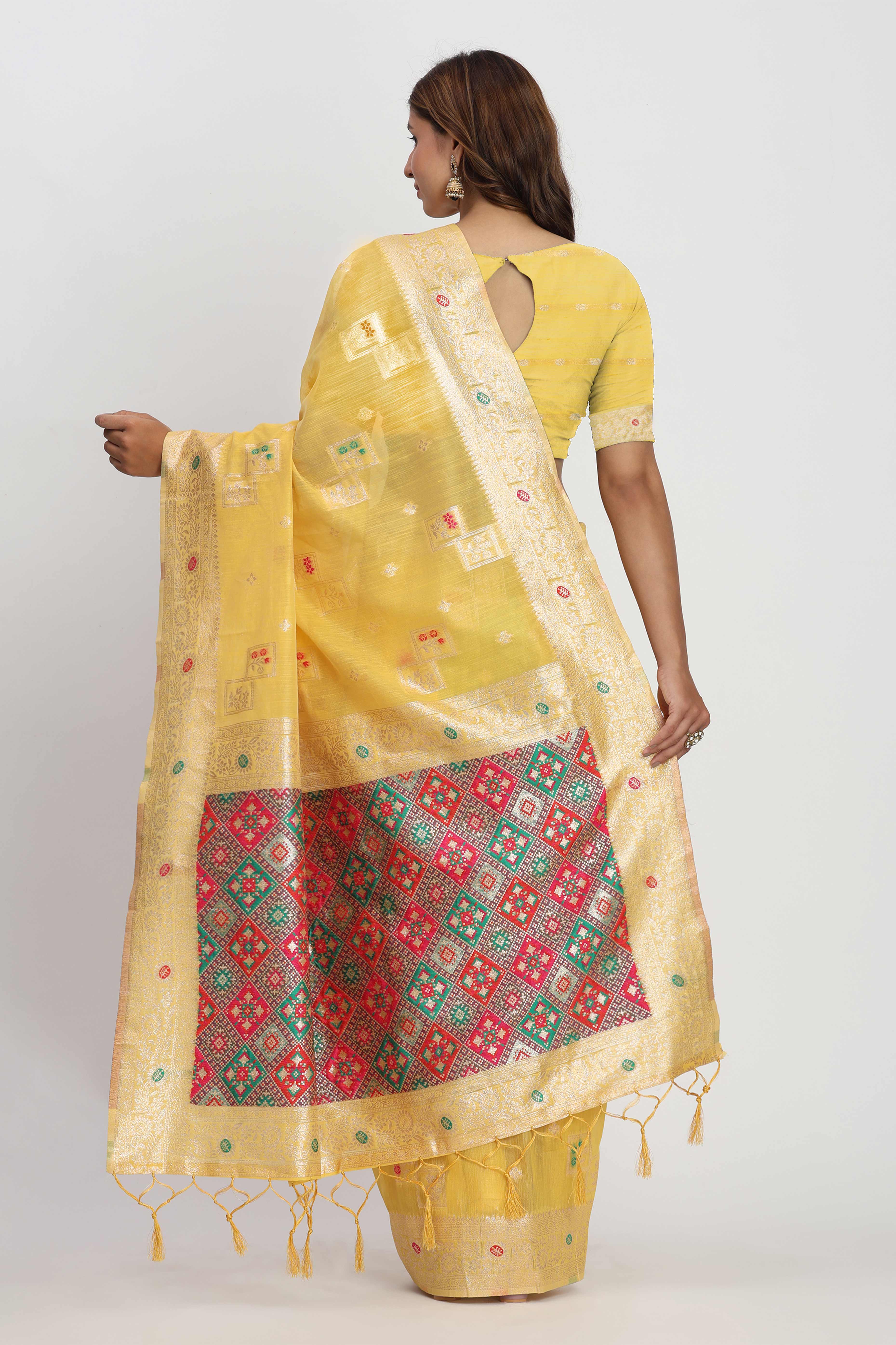 Floral Zari Weaving Brings Regal Beauty To This Yellow Linen Cotton Saree With Tassel Accents