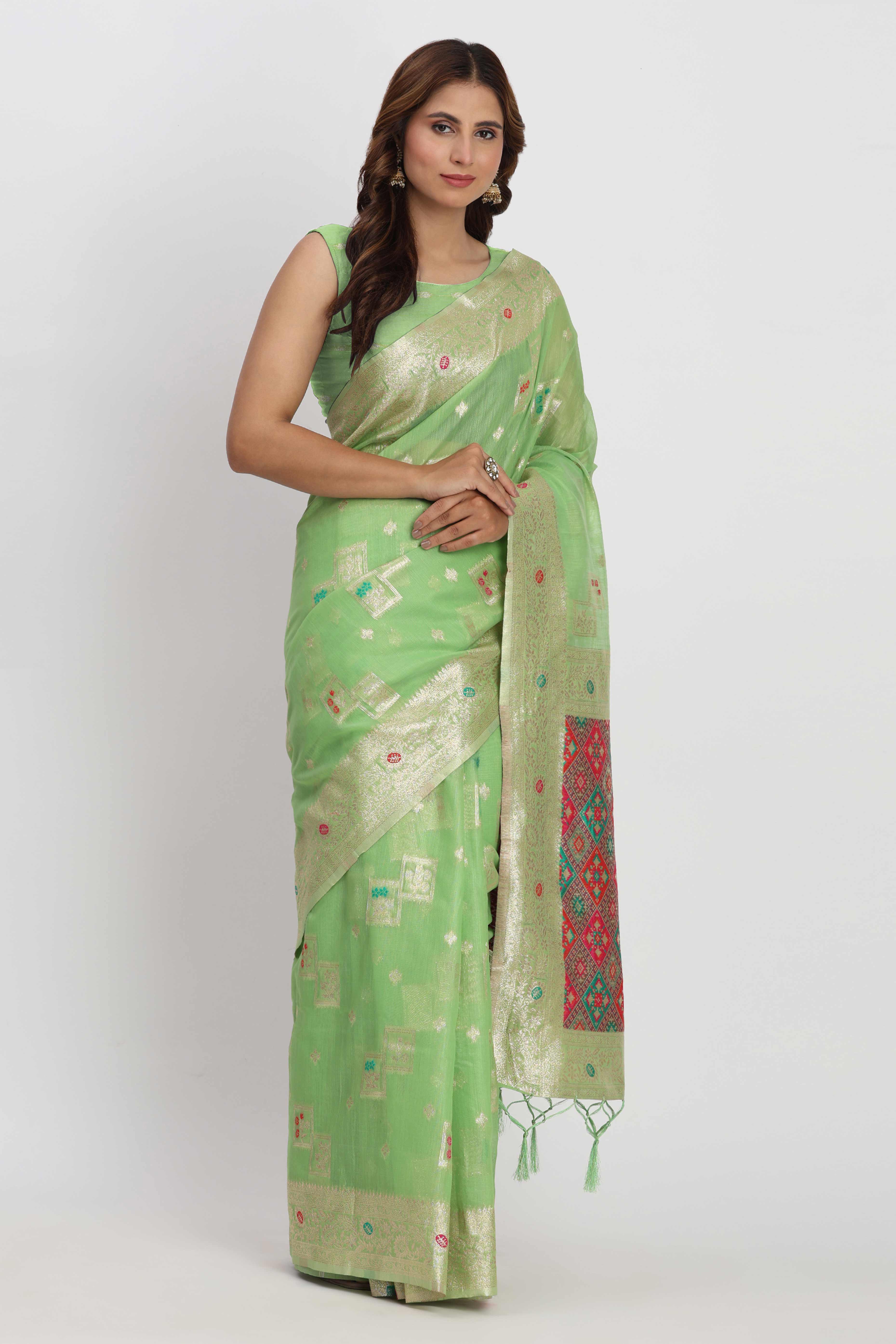 Floral Zari Weaving Brings Regal Beauty To This Light Green Linen Cotton Saree With Tassel Accents