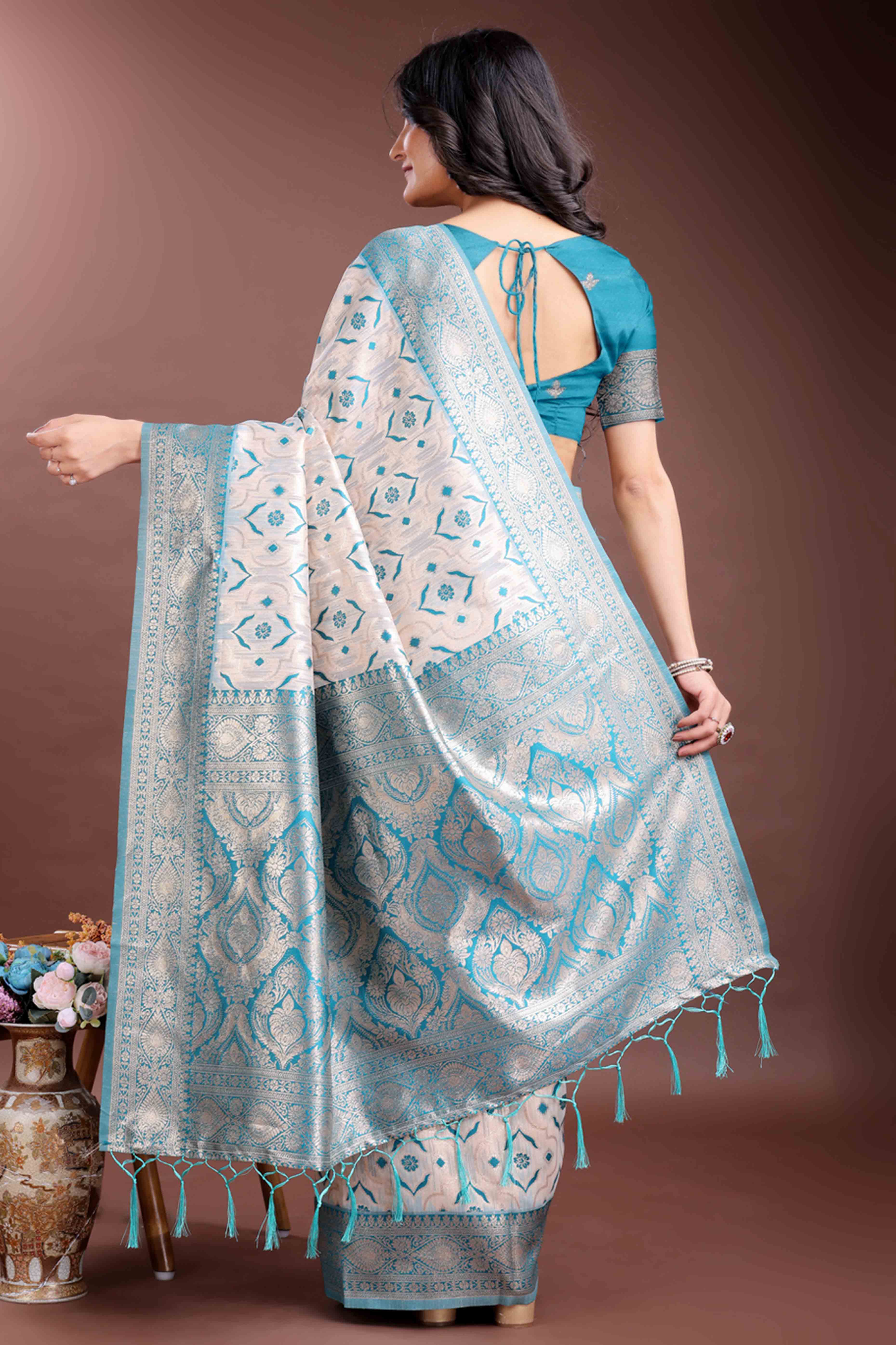 Brilliant Turquoise Traditional Ikkat Style Zari Weaving Cotton Blend Saree with Stunning Tassel Accents