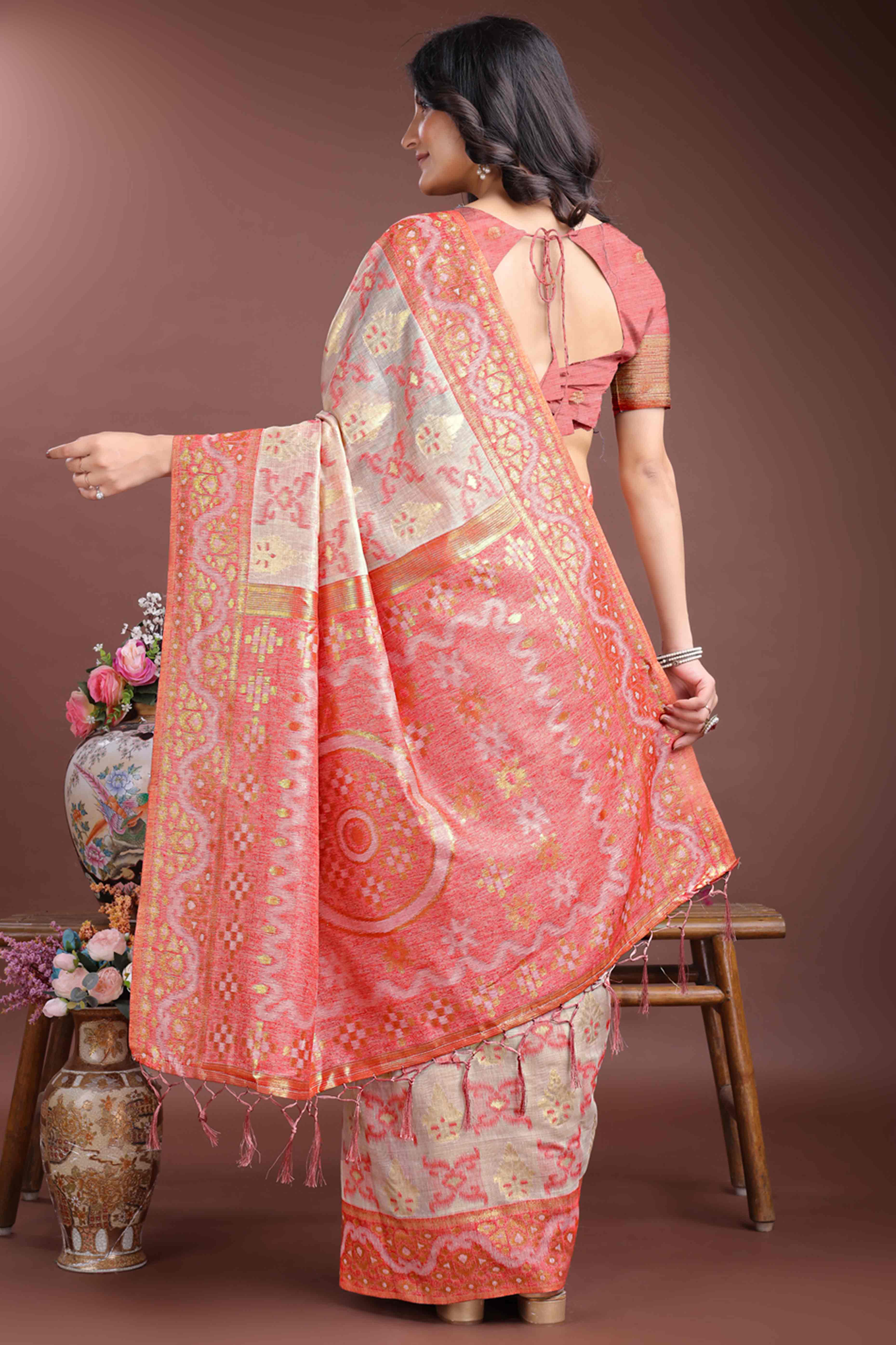 Exquisite Peach Traditional Ikkat Style Zari Weaving Cotton Blend Saree with Delicate Tassels