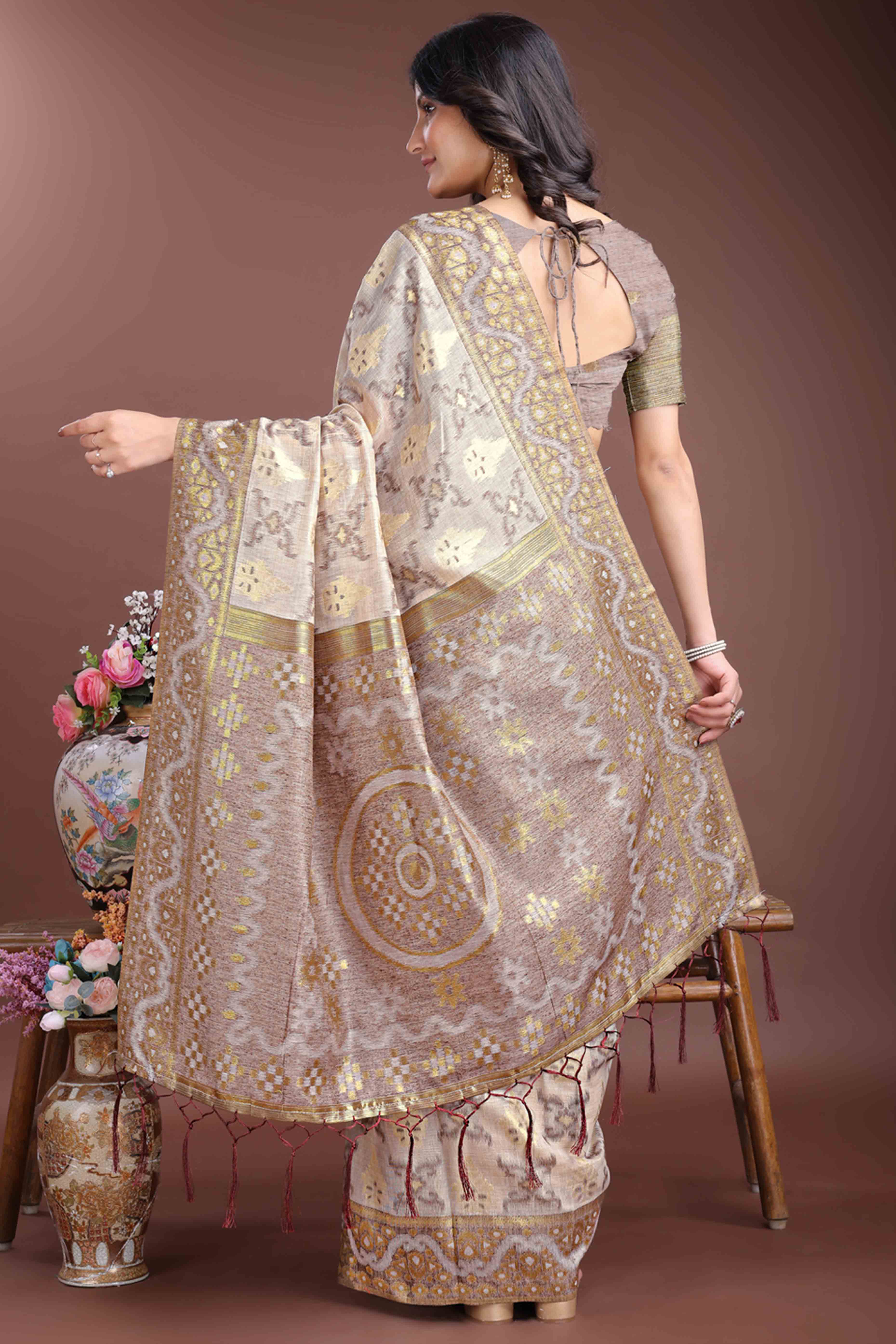 Sophisticated Brown Traditional Ikkat Style Zari Weaving Cotton Blend Saree Adorned with Elegant Tassels
