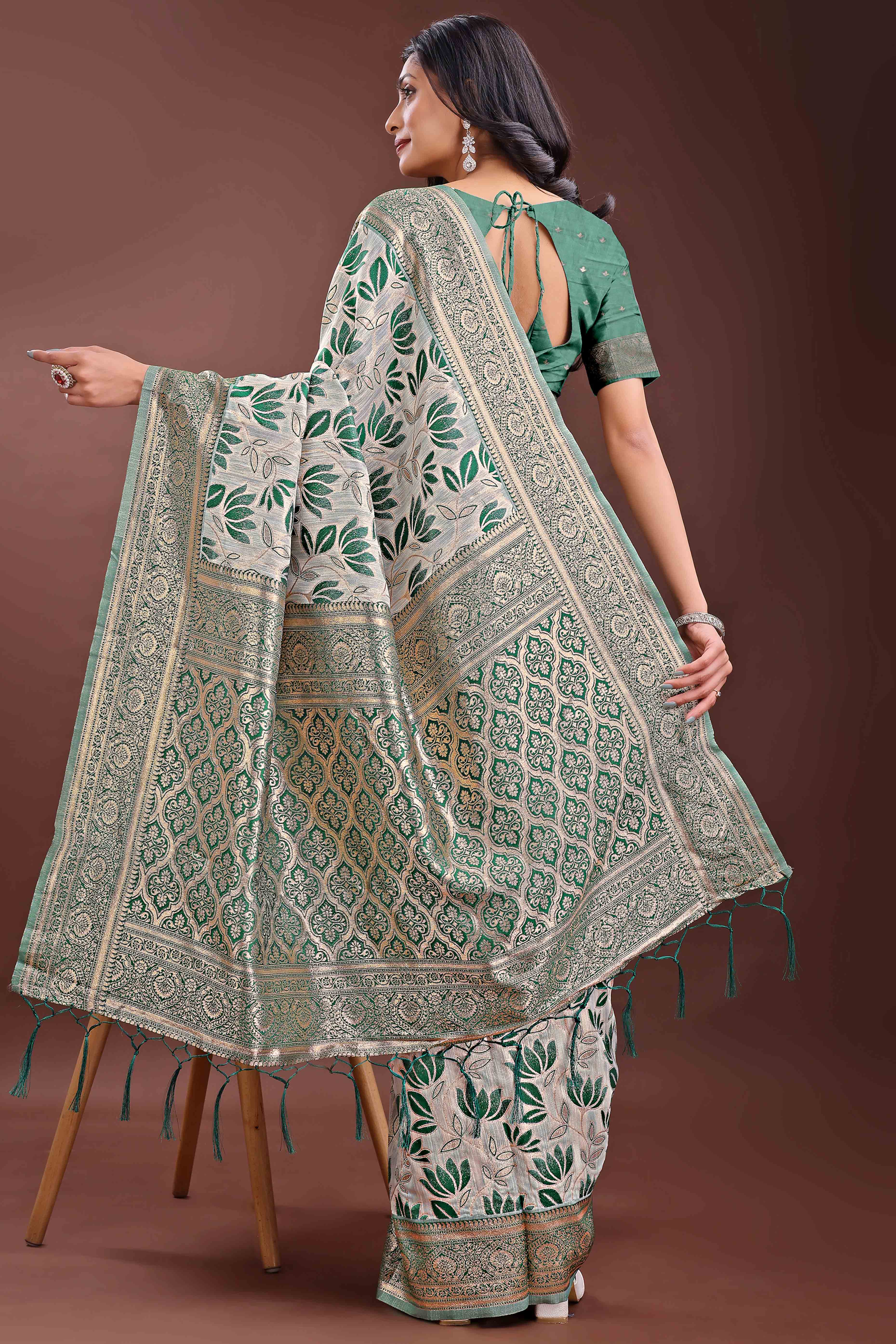Green Linen Cotton Saree Featuring Graceful Floral Patterns in Zari Weave