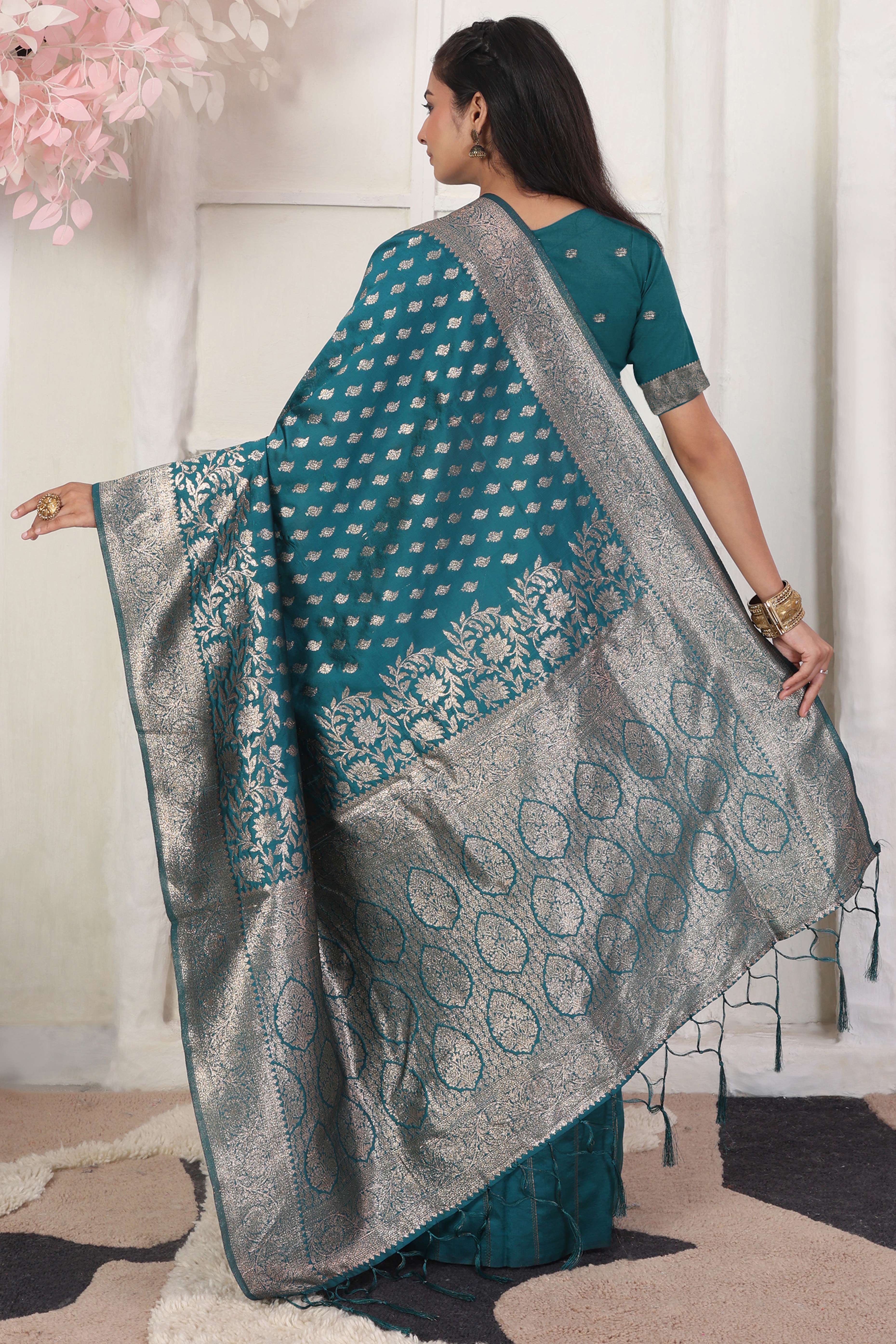 Rama Blue Traditional Lichi Silk Blend Saree Enhanced With Floral Zari Weaving & Tassel Pallu