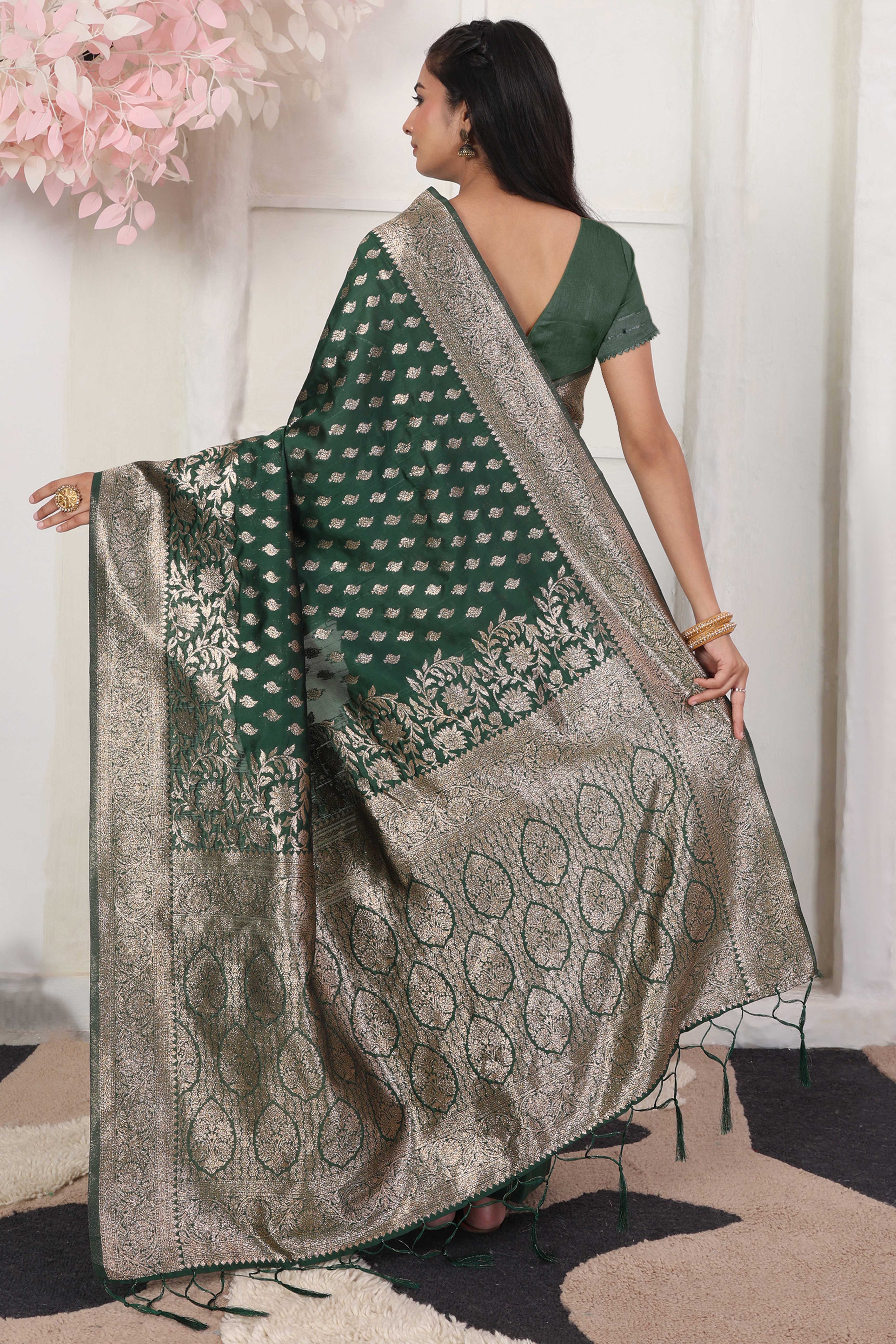 Green Traditional Lichi Silk Blend Saree Enhanced With Floral Zari Weaving & Tassel Pallu