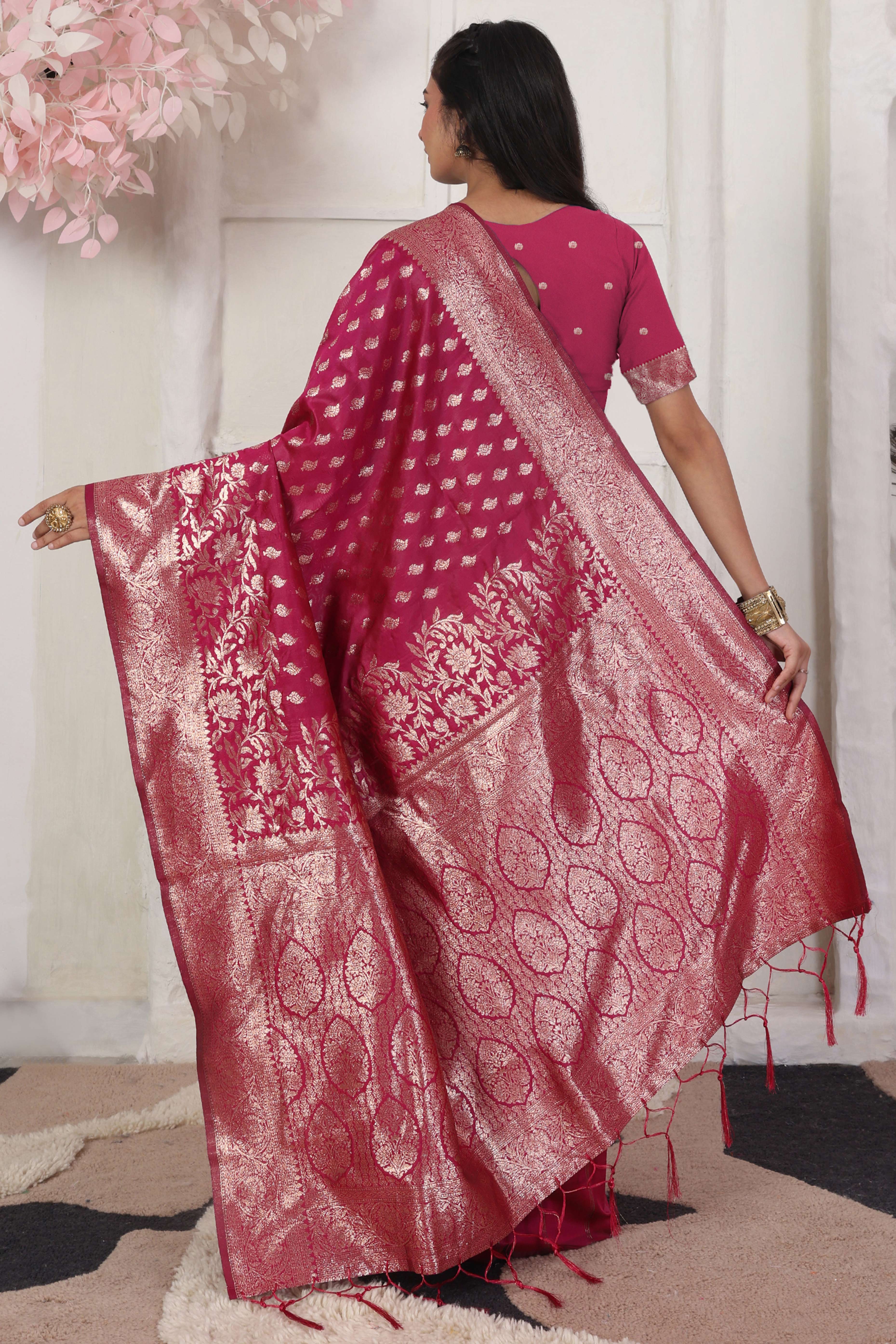 Pink Traditional Lichi Silk Blend Saree Enhanced With Floral Zari Weaving & Tassel Pallu