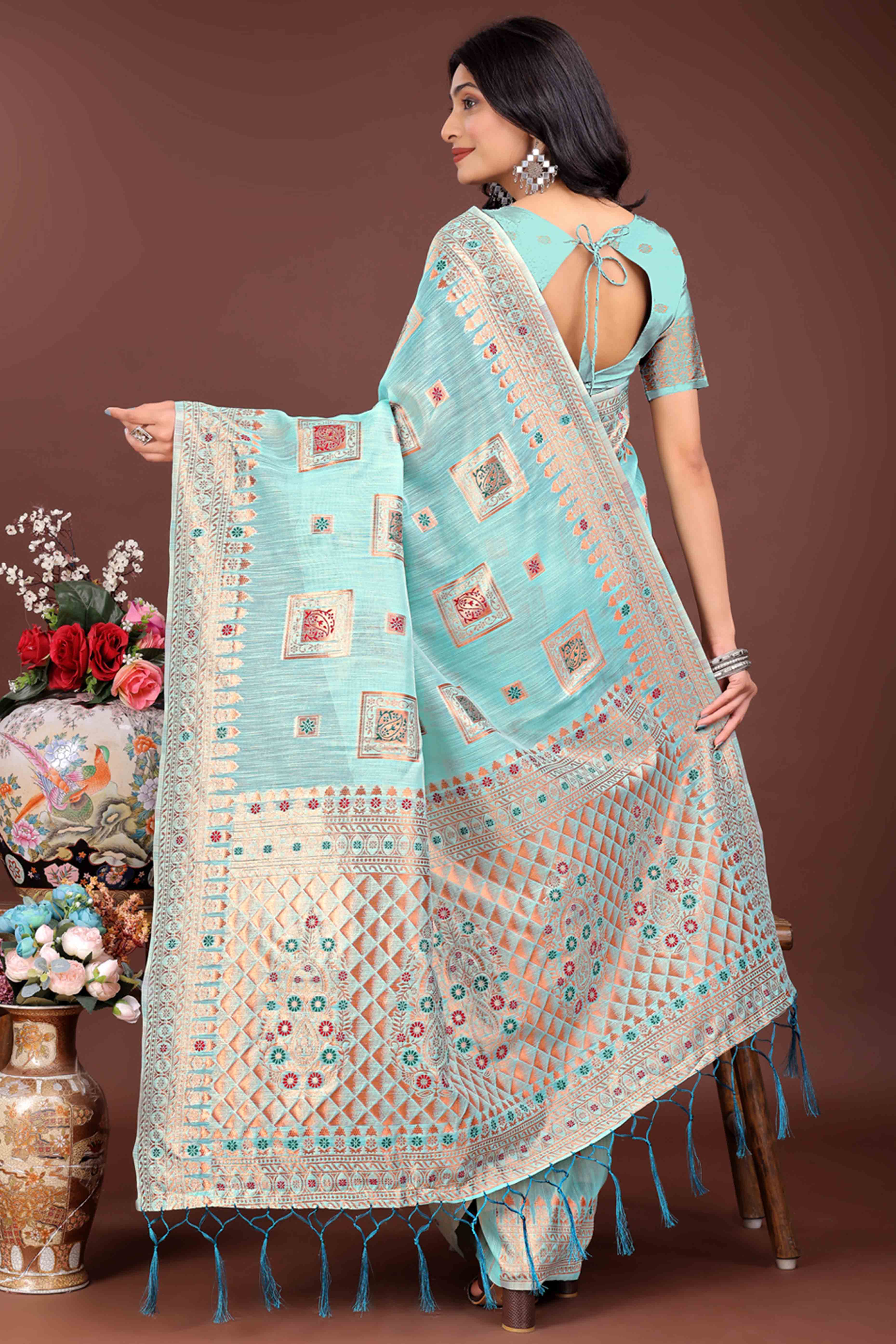 Majestic Floral Zari Weaving Embellished Pale Blue Saree In Linen Cotton with Tassel Accents