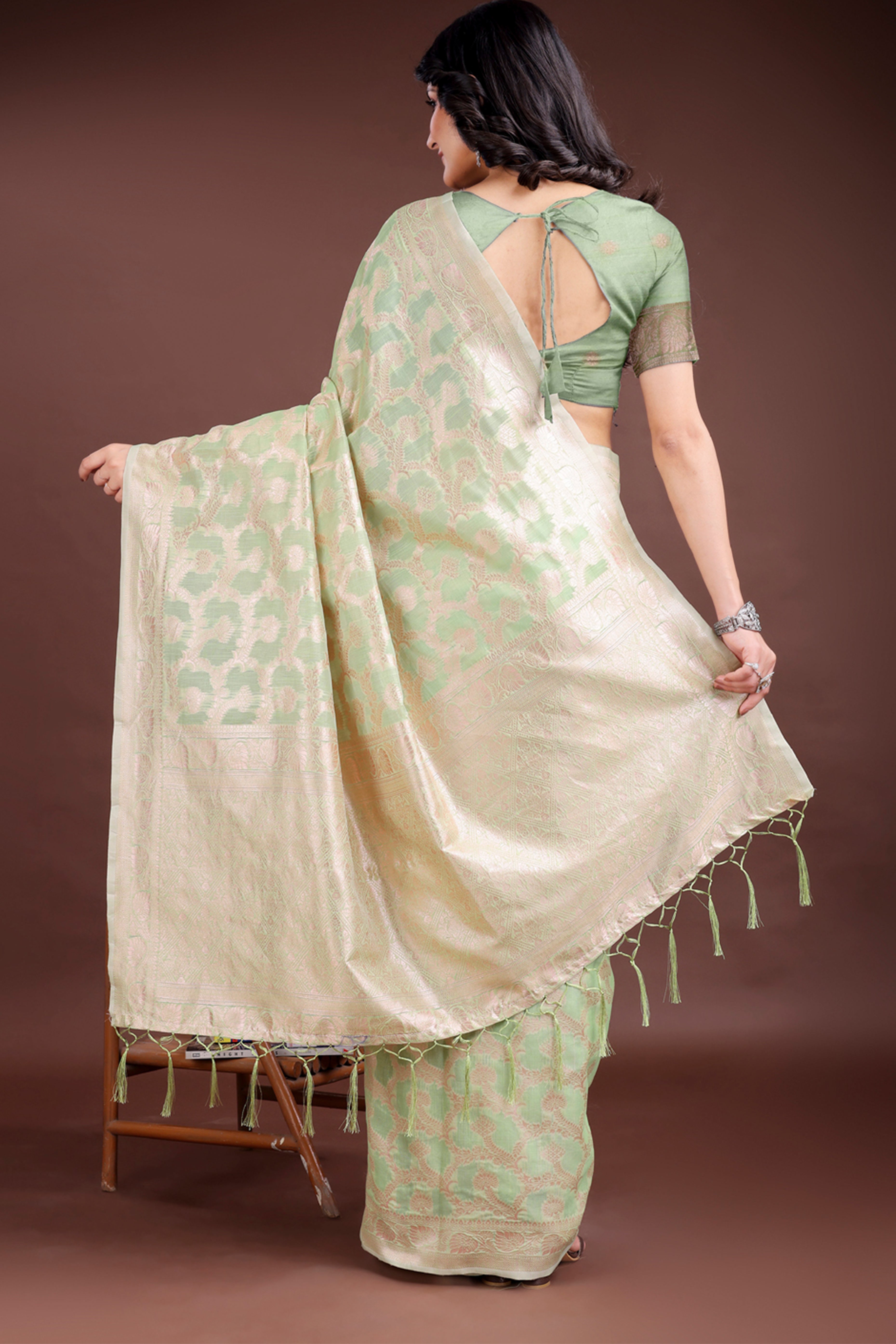 Light Green Linen Cotton Saree with Lustrous Zari Borders and Elegant Tassel Accents