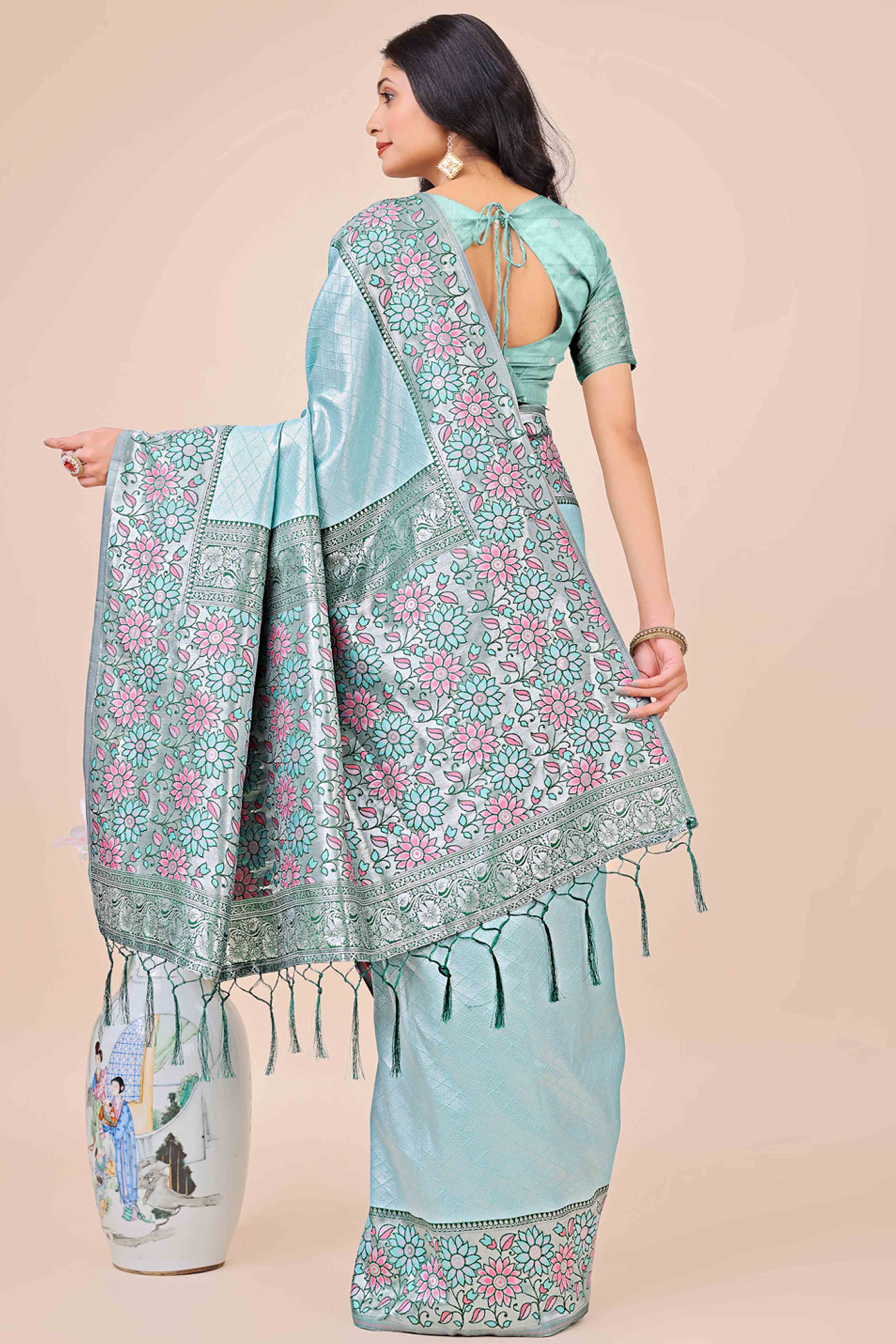Light Blue Lichi Silk Blend Saree With Exquisite Floral Weaving & Graceful Tassel Details