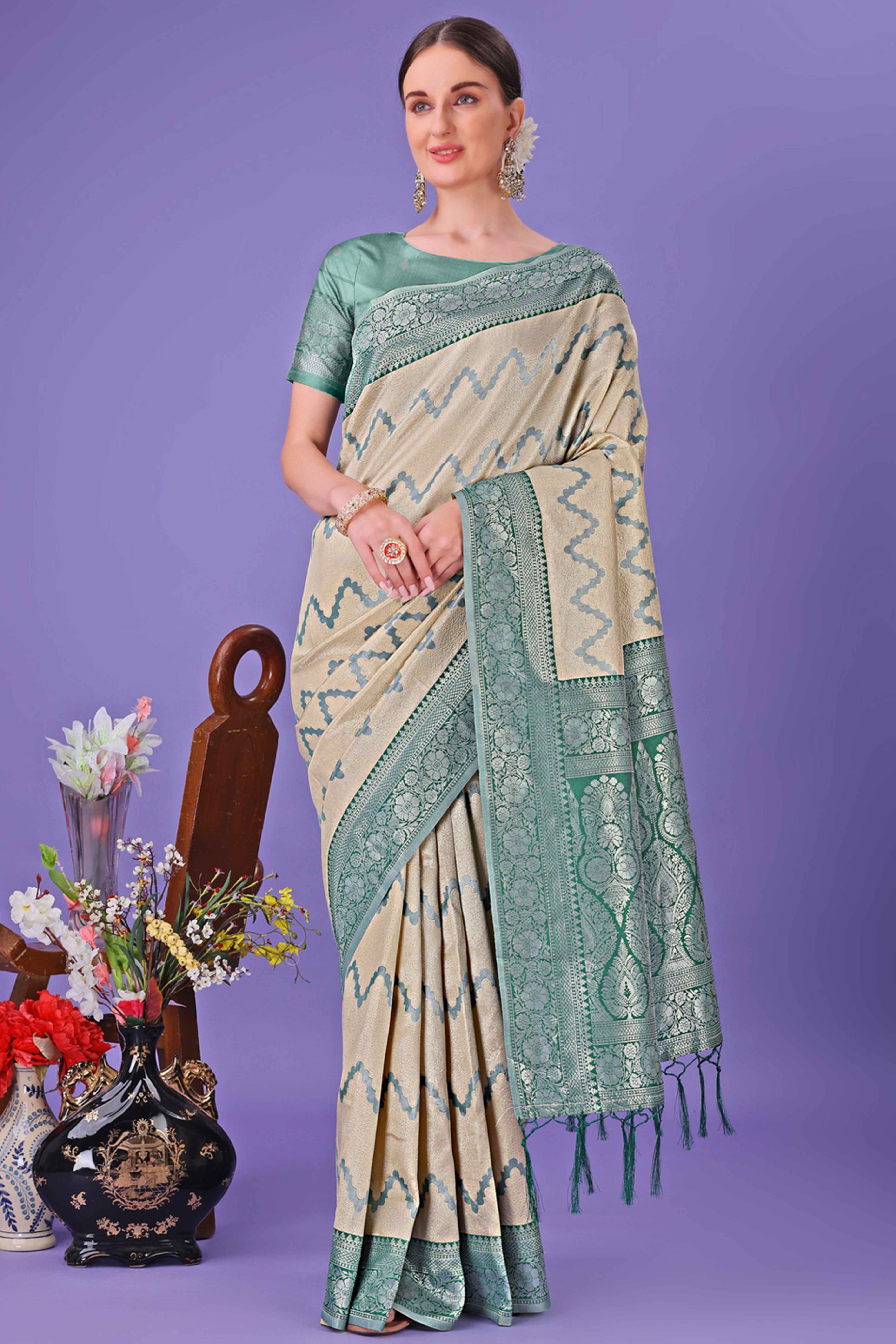 Cream Lichi Cotton Silk Saree Adorned With Floral Zari Weave & Tassels