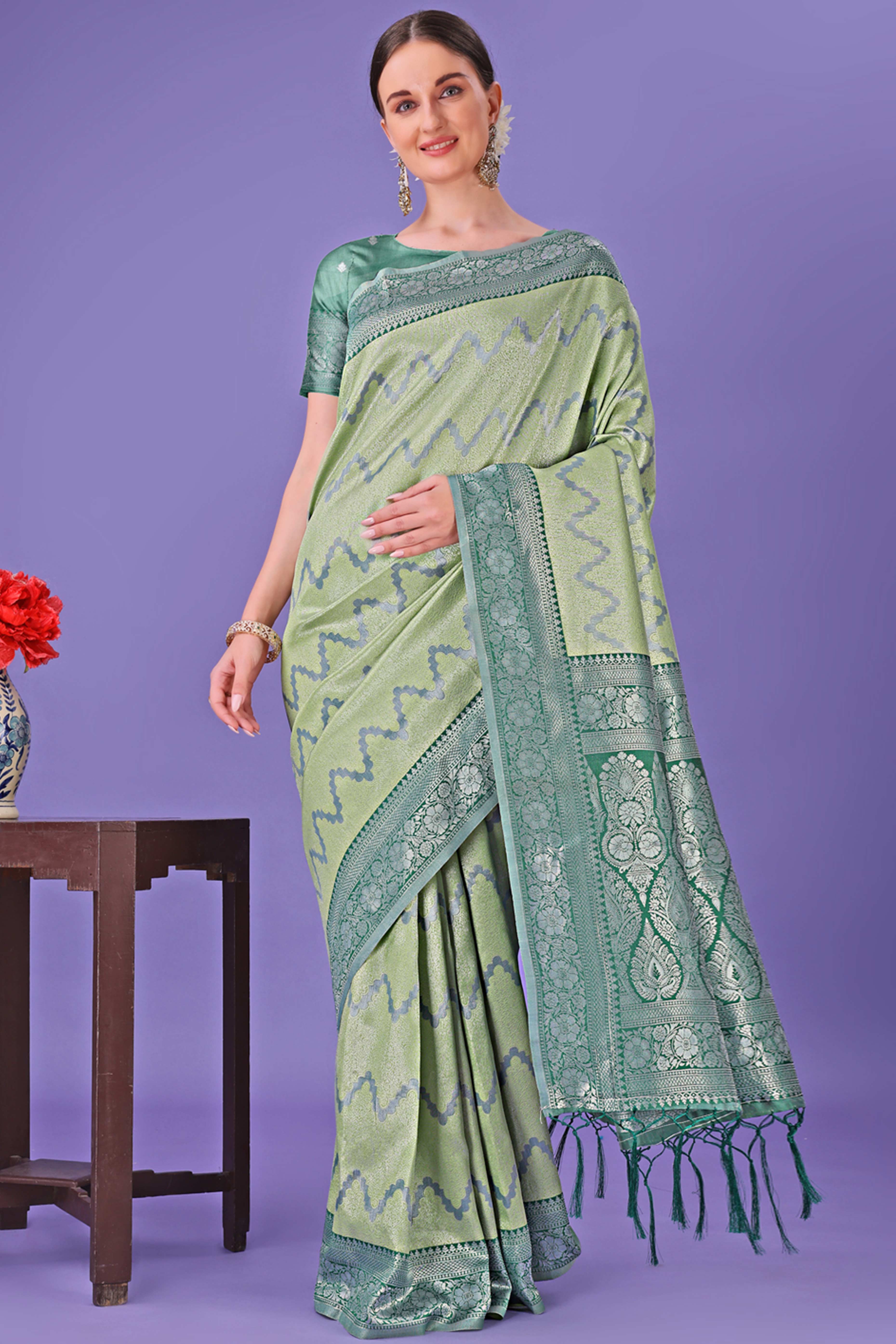 Light Green Lichi Cotton Silk Saree Adorned With Floral Zari Weave & Tassels