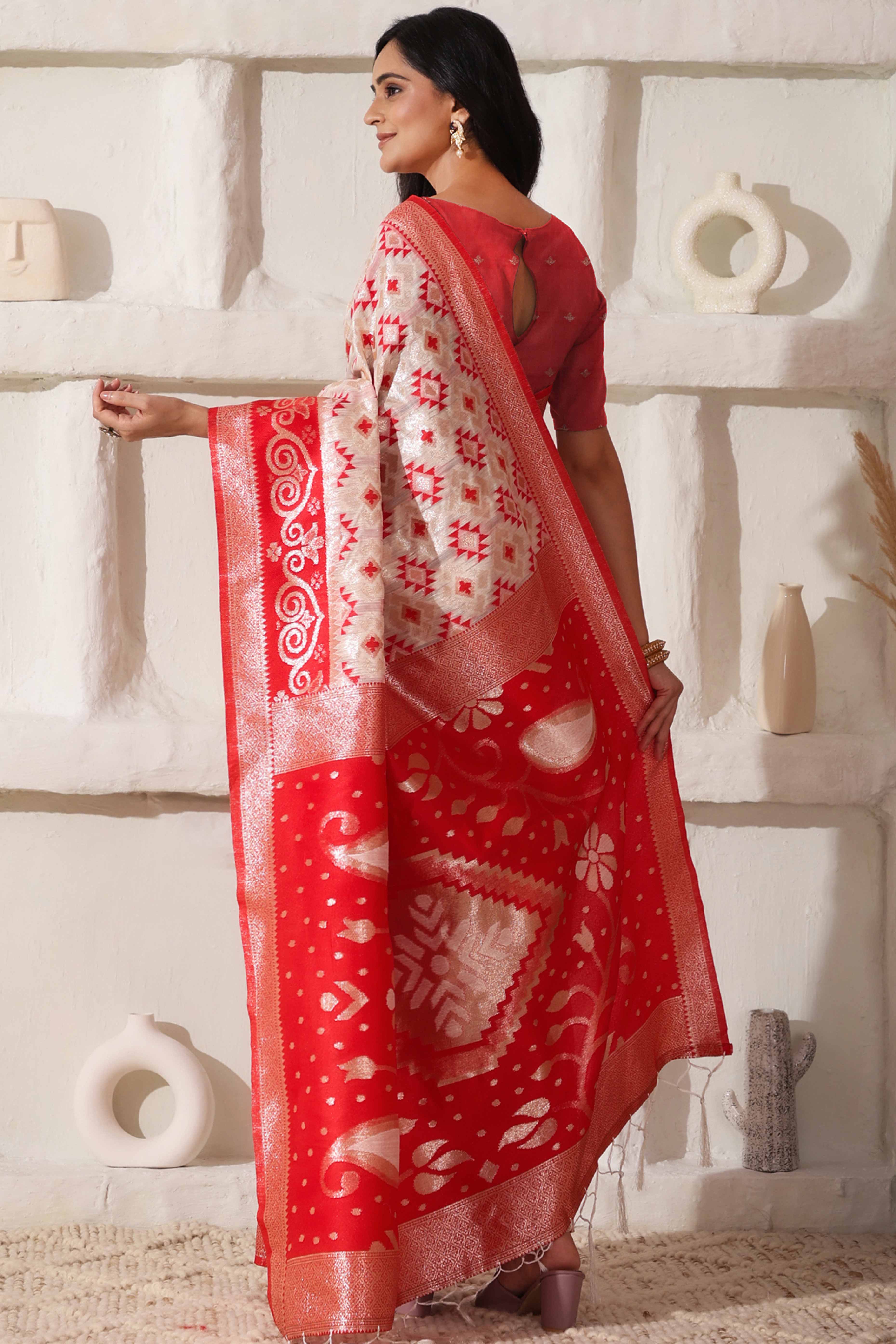 White & Red Linen Cotton Saree Featuring Fine Zari Weaving And A Tasselled Finish