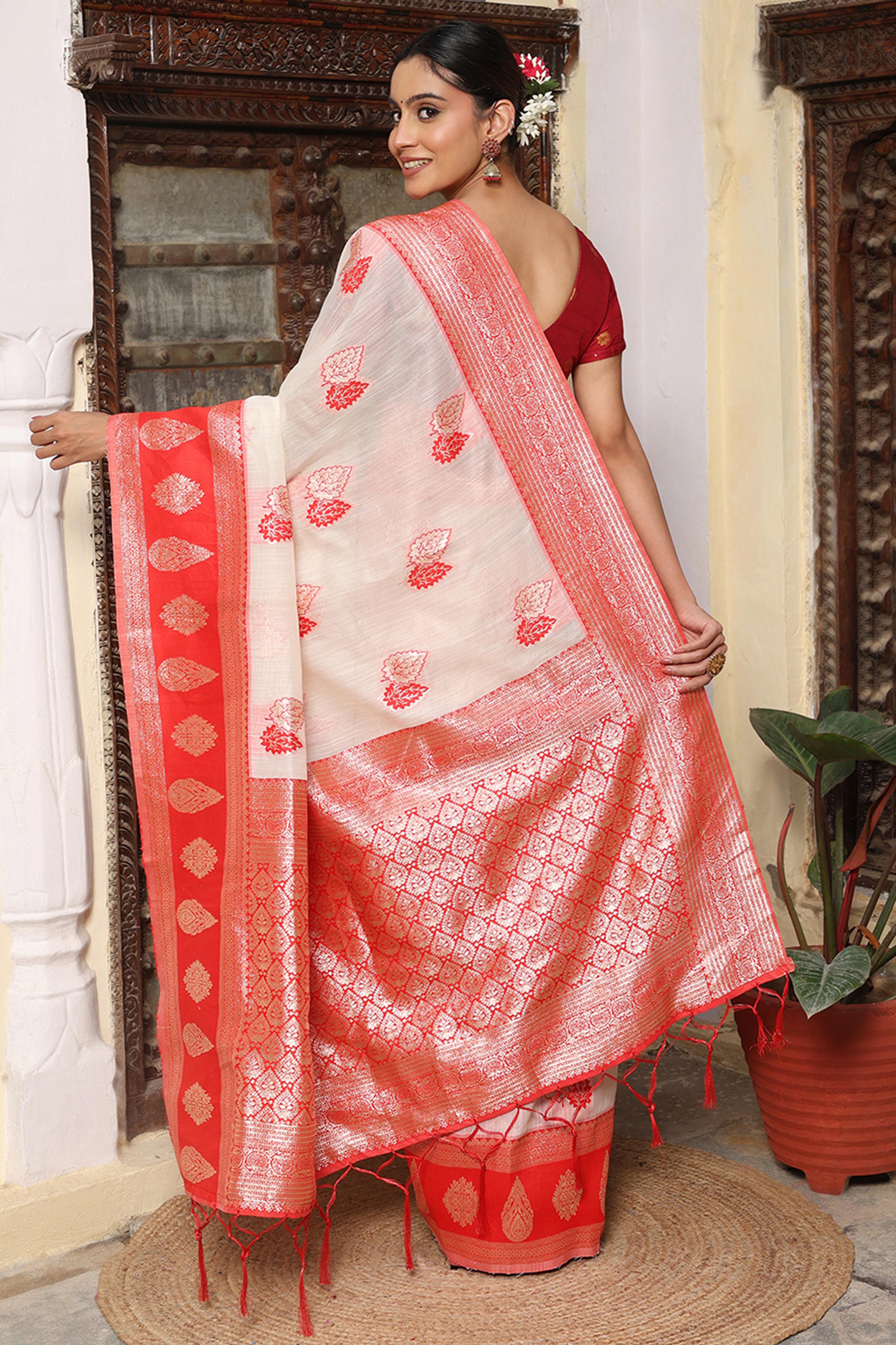 Festive White & Red Linen Cotton Saree Featuring Rich Zari Weaving