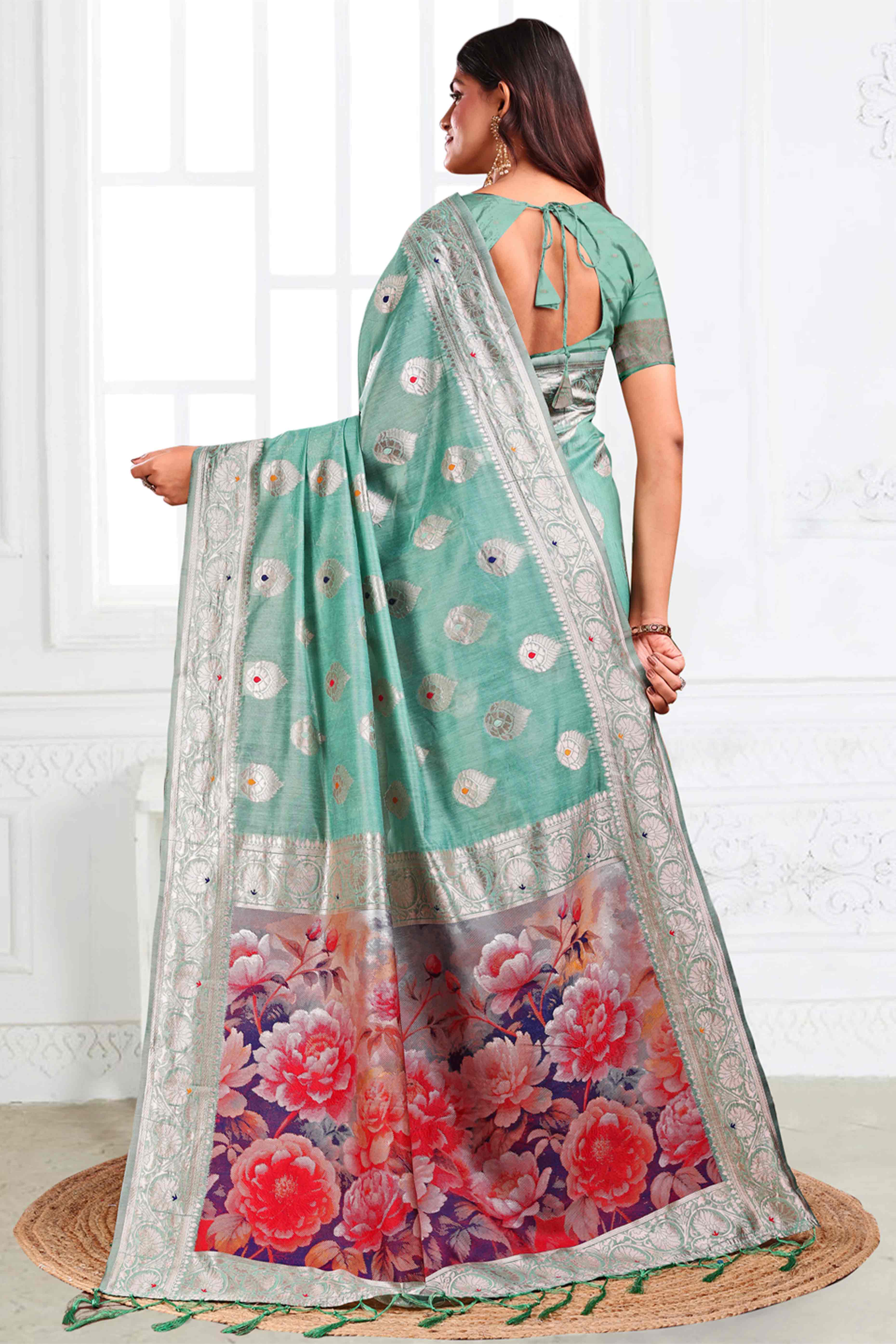 Turquoise Linen Cotton Silk Saree Adorned With Intricate Floral Zari Weaving & Tassel Pallu