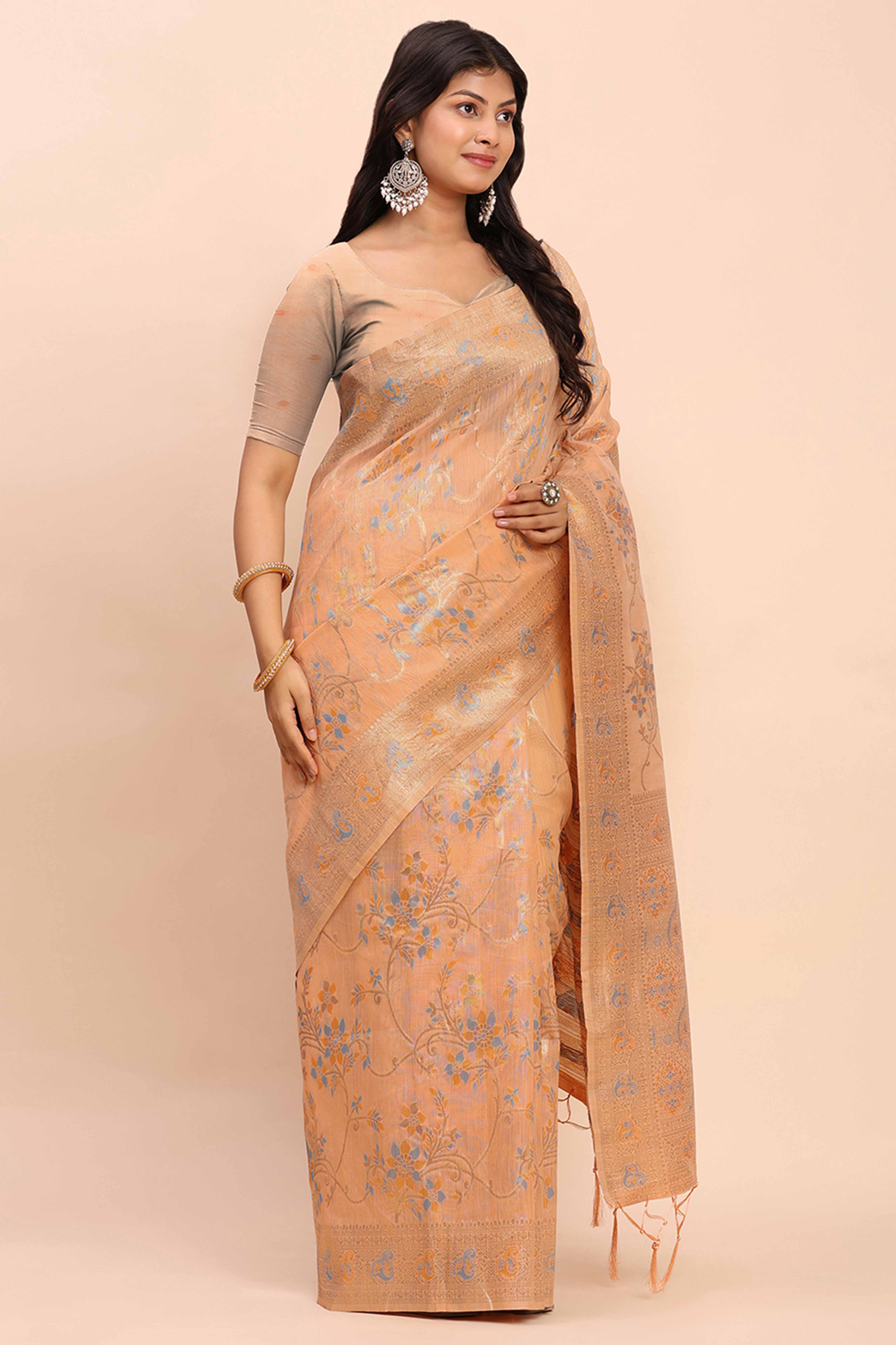 Light Orange Linen Cotton Saree Showcasing Floral Zari Weaves & A Tasselled Finish Pallu