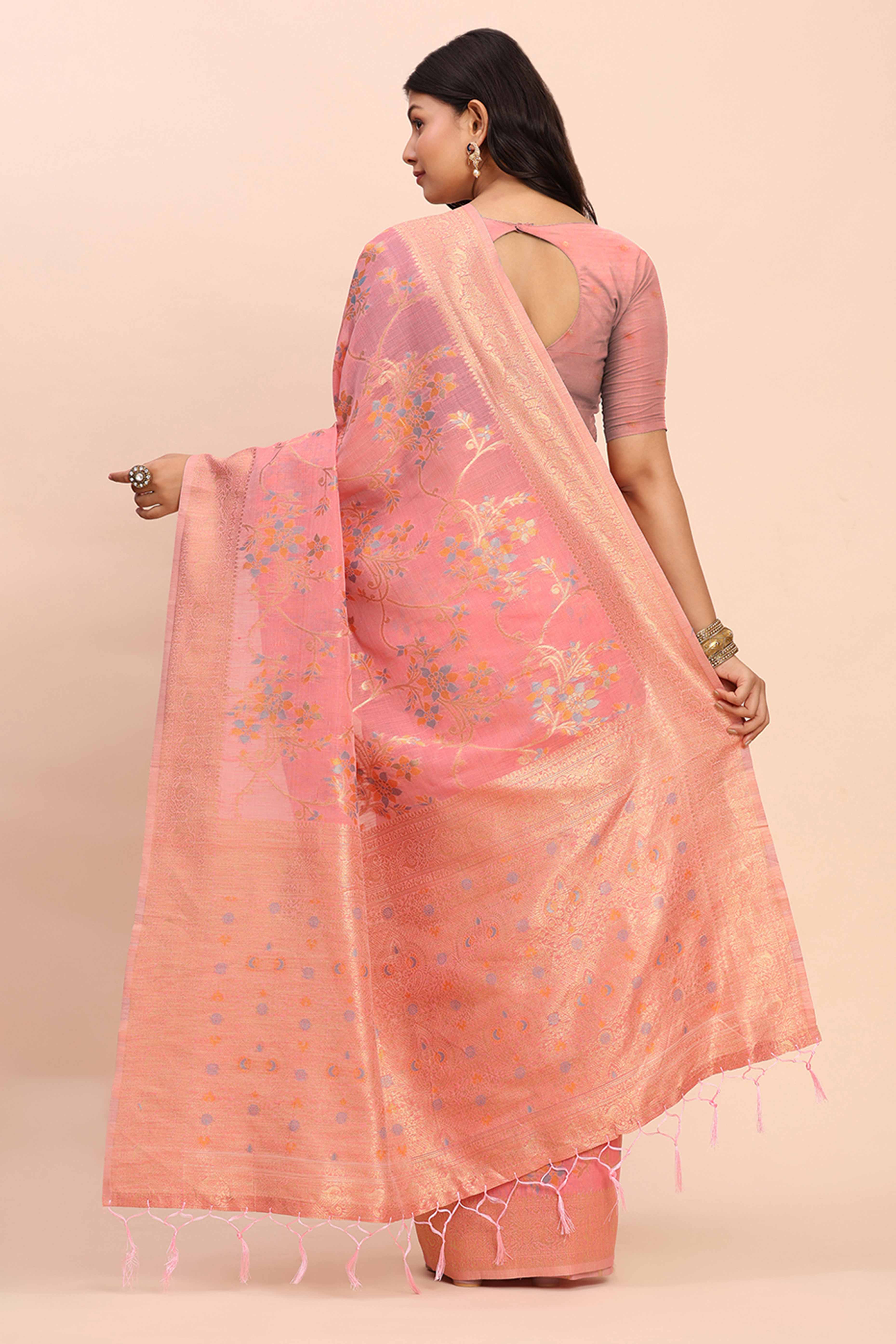 Salmon Pink Linen Cotton Saree Showcasing Floral Zari Weaves & A Tasselled Finish Pallu