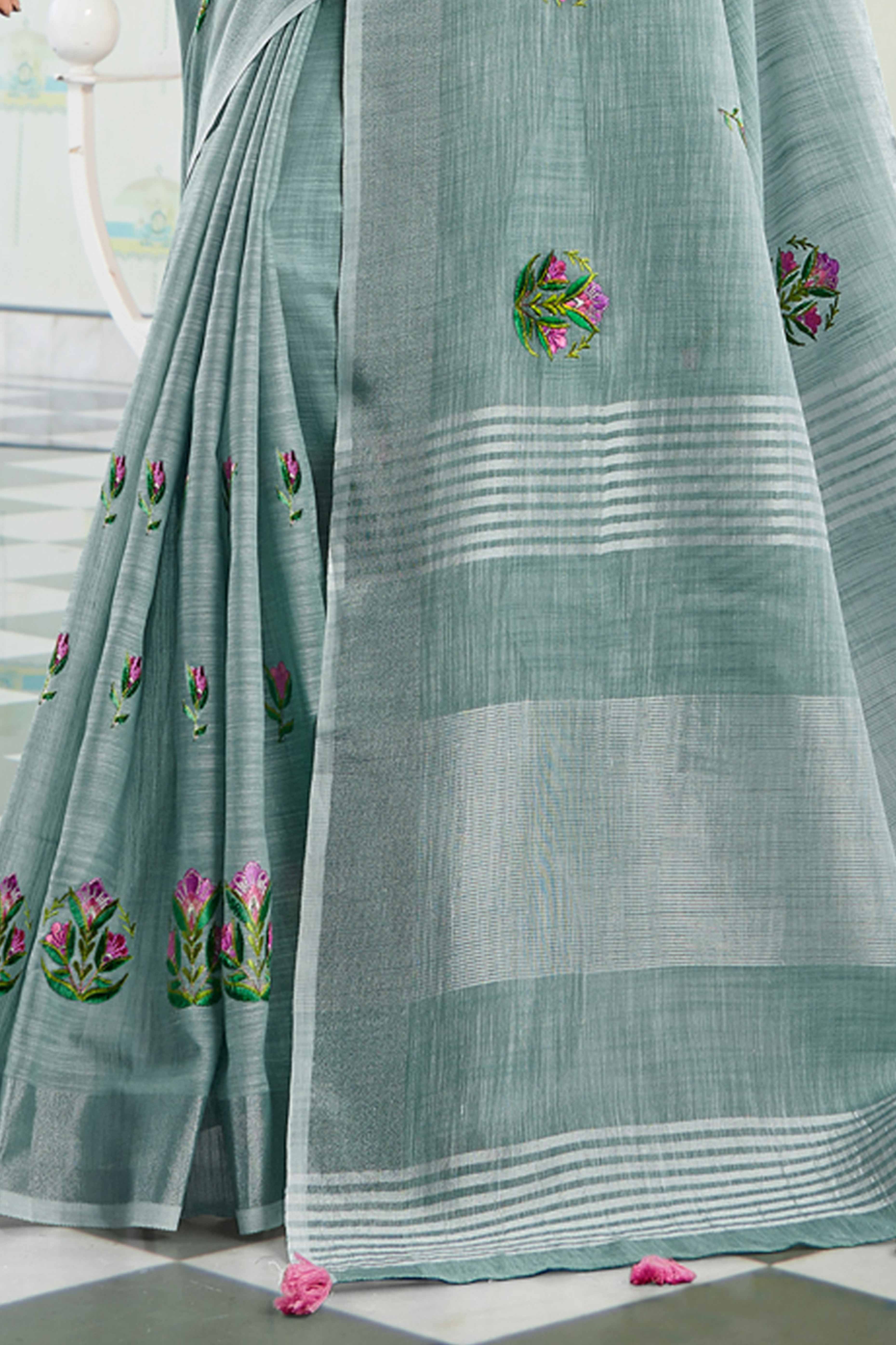 Sea Green Linen Saree with Intricate Floral Embroidery and Classic Weaving