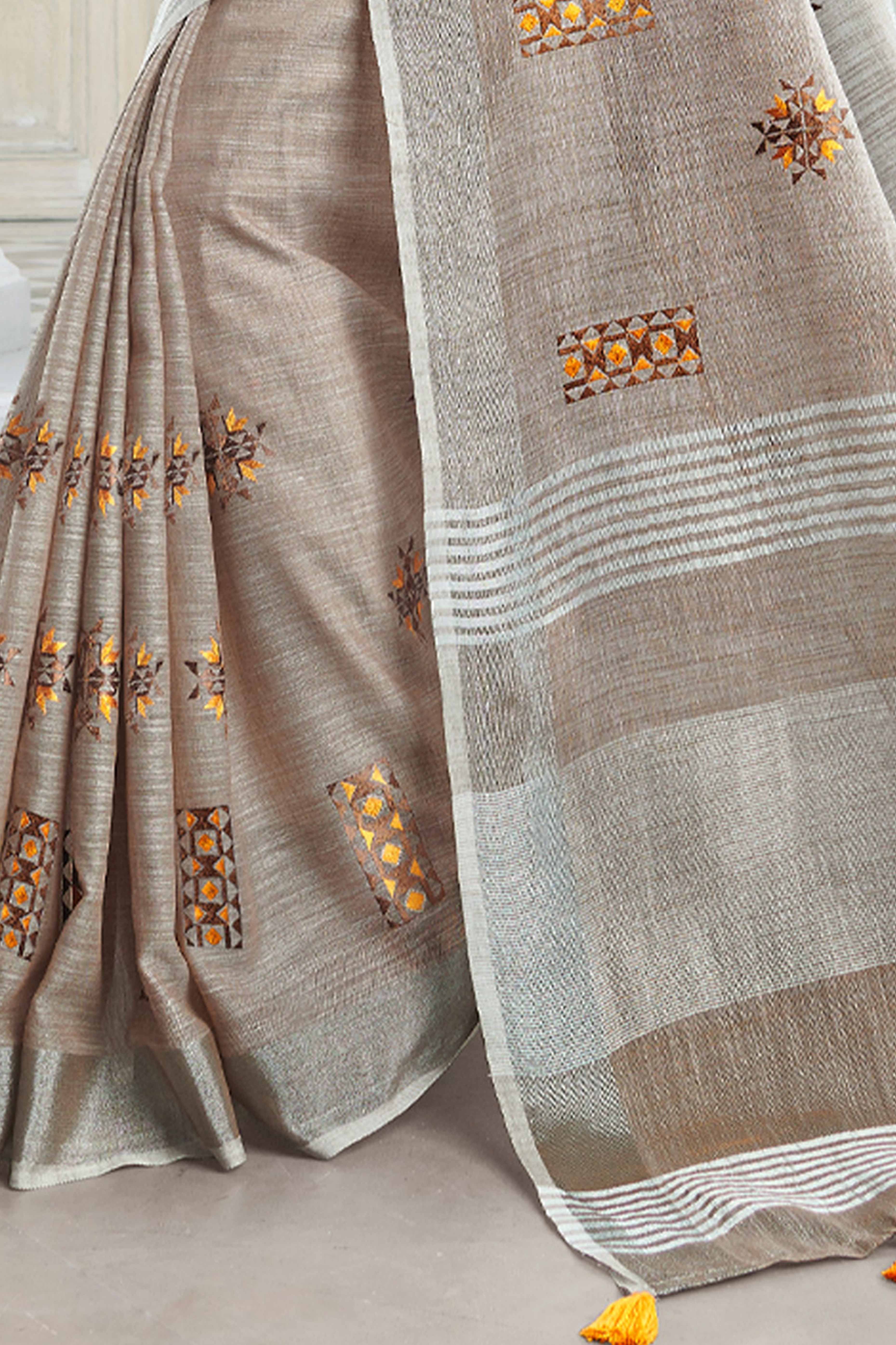 Light Beige Linen Saree with Intricate Floral Embroidery and Classic Weaving