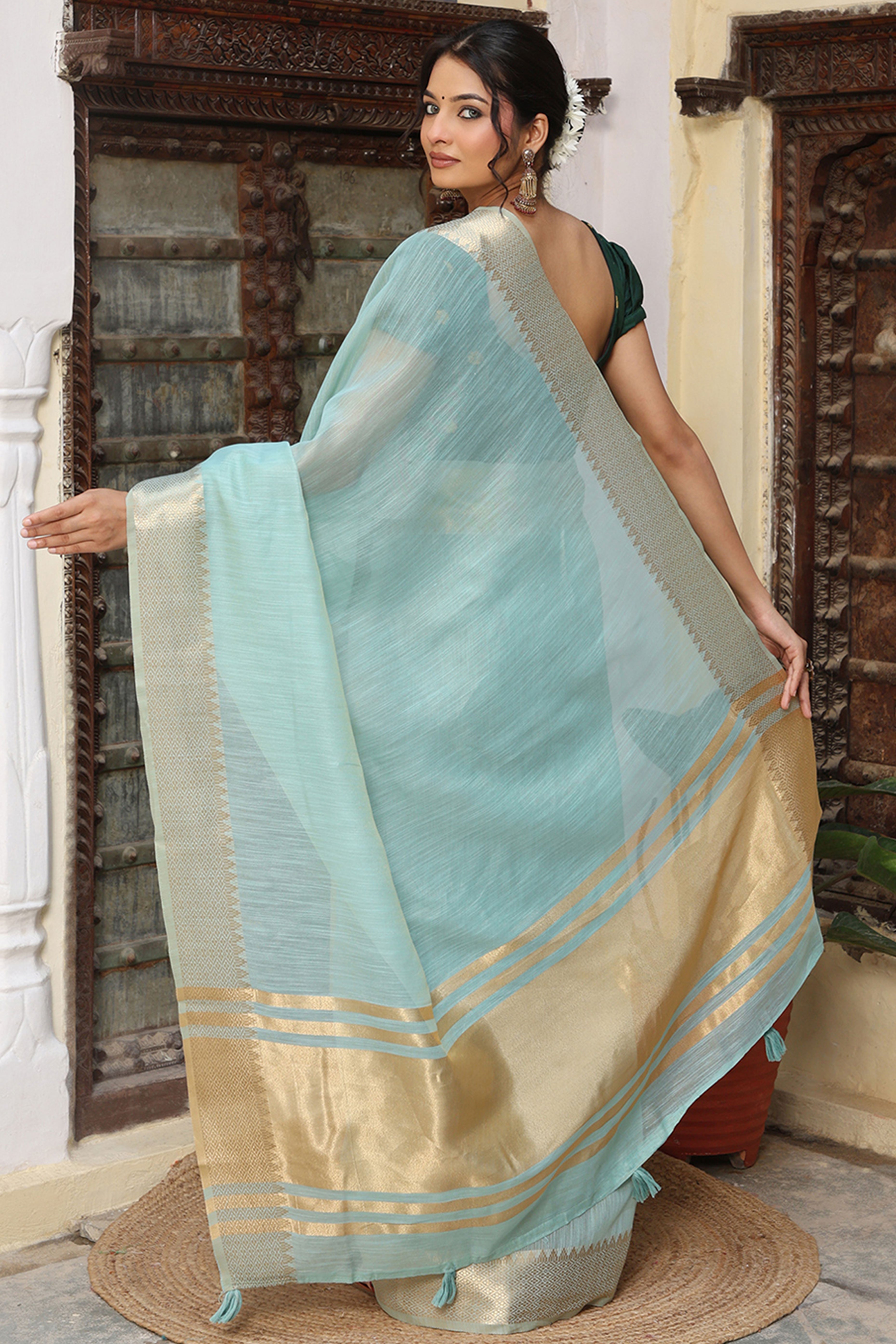 Trendy Sky Blue Cotton Blend Saree Showcasing Elegant Zari Weaving & Tassel Border Pallu