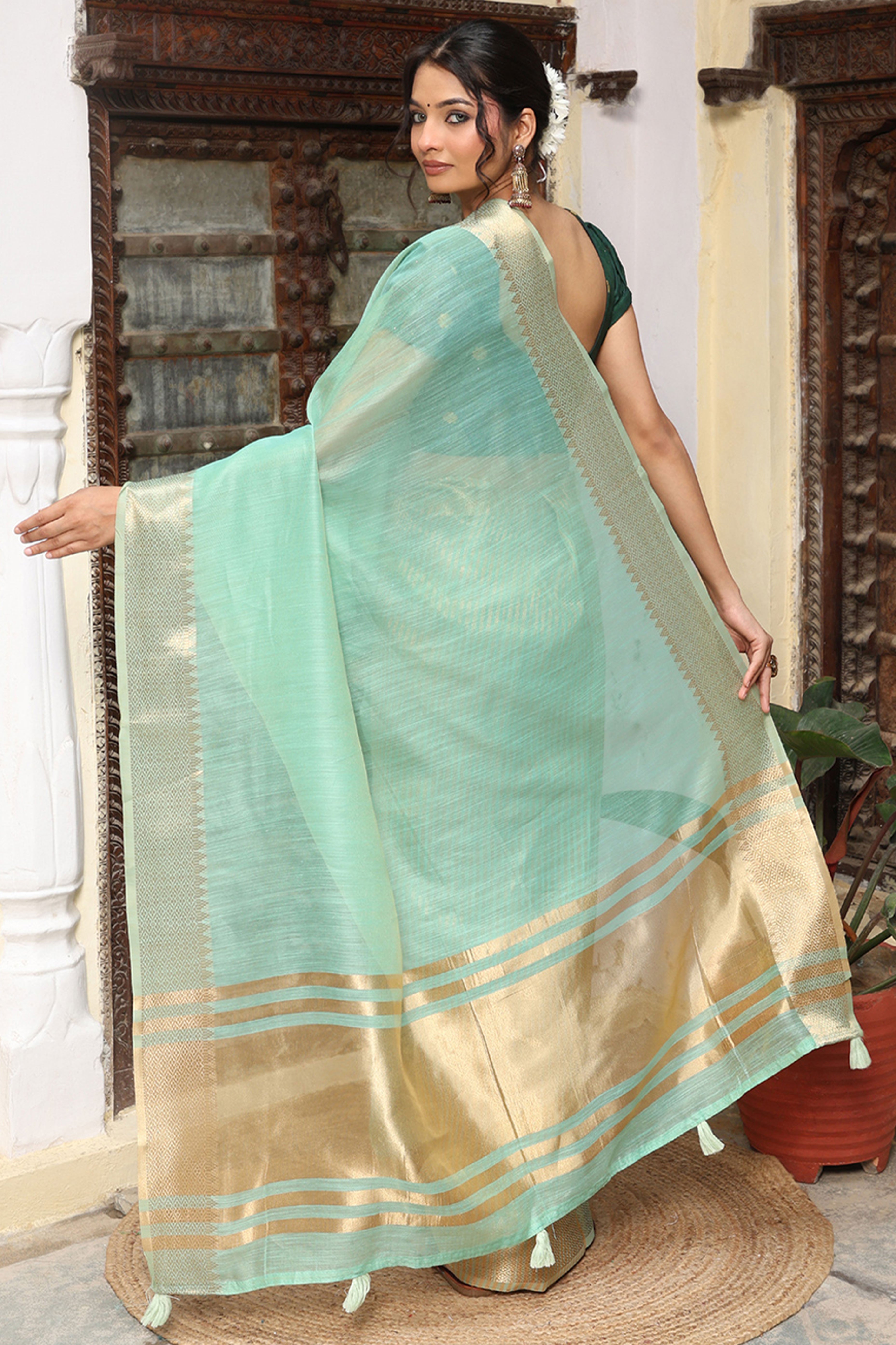 Trendy Turquoise Cotton Blend Saree Showcasing Elegant Zari Weaving & Tassel Border Pallu