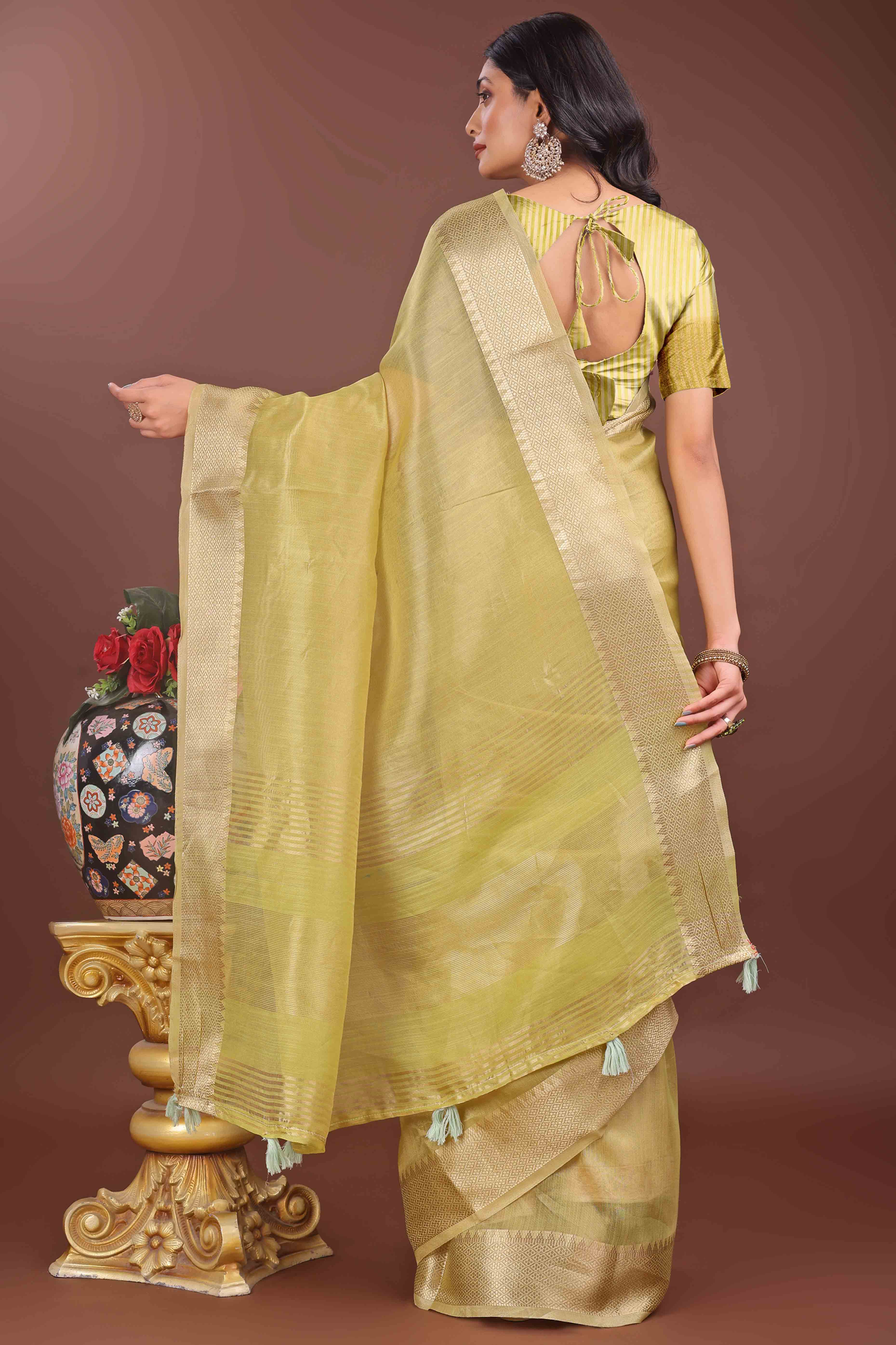 Green Solid With Zari Woven Organza Saree With Tassel Border