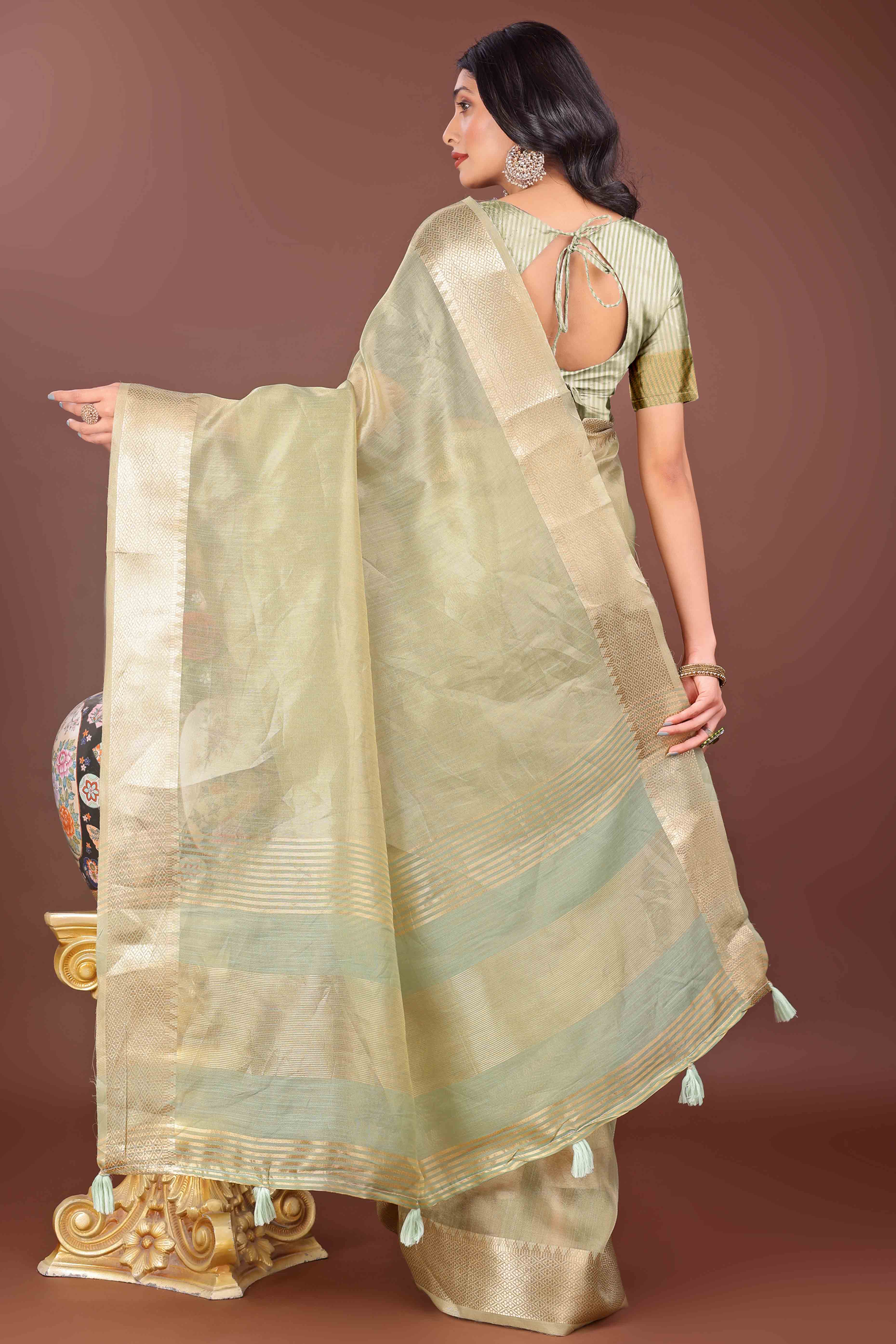 Light Green Solid With Zari Woven Organza Saree With Tassel Border