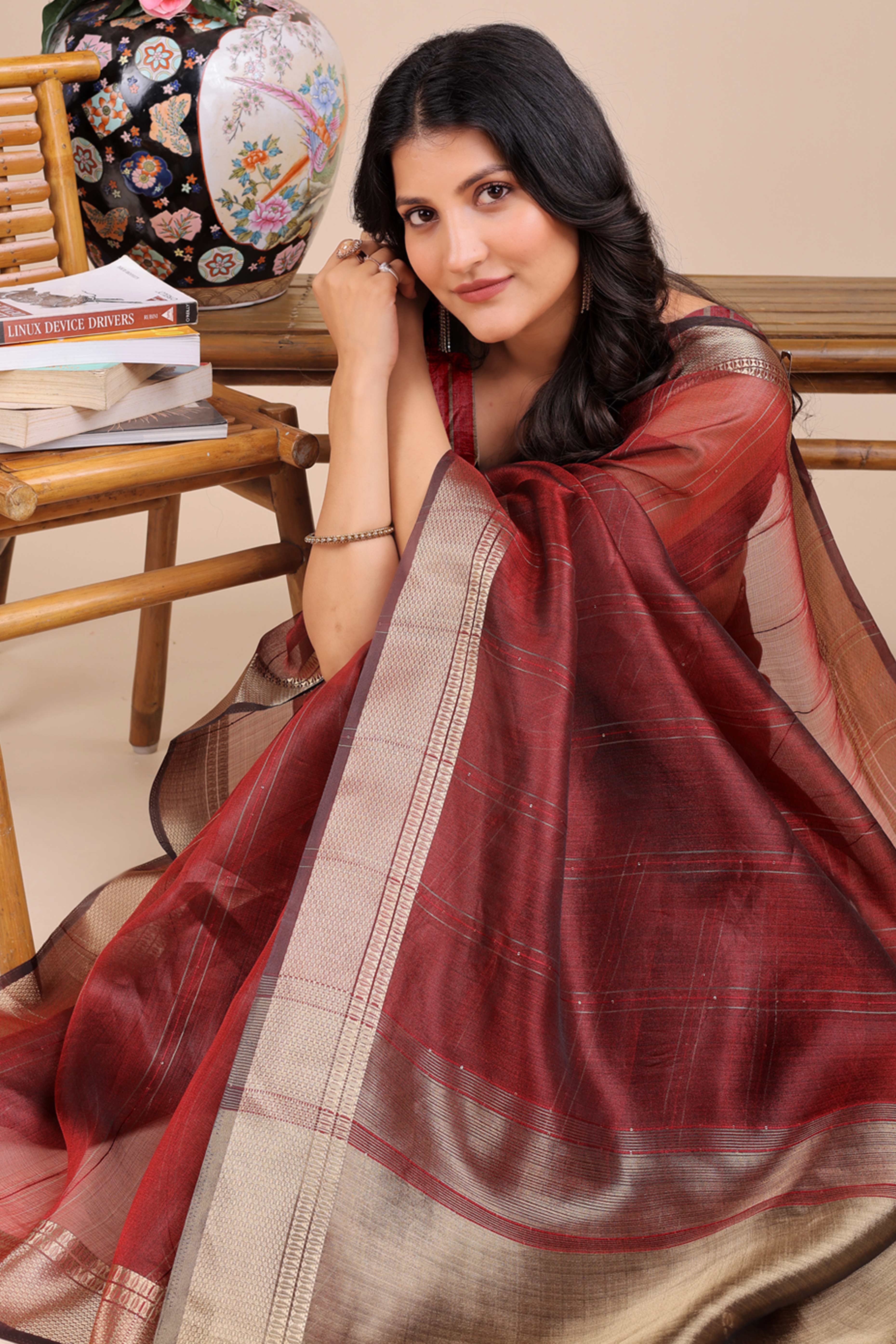 Maroon Hue Organza Saree with Shimmering Zari Border Weave