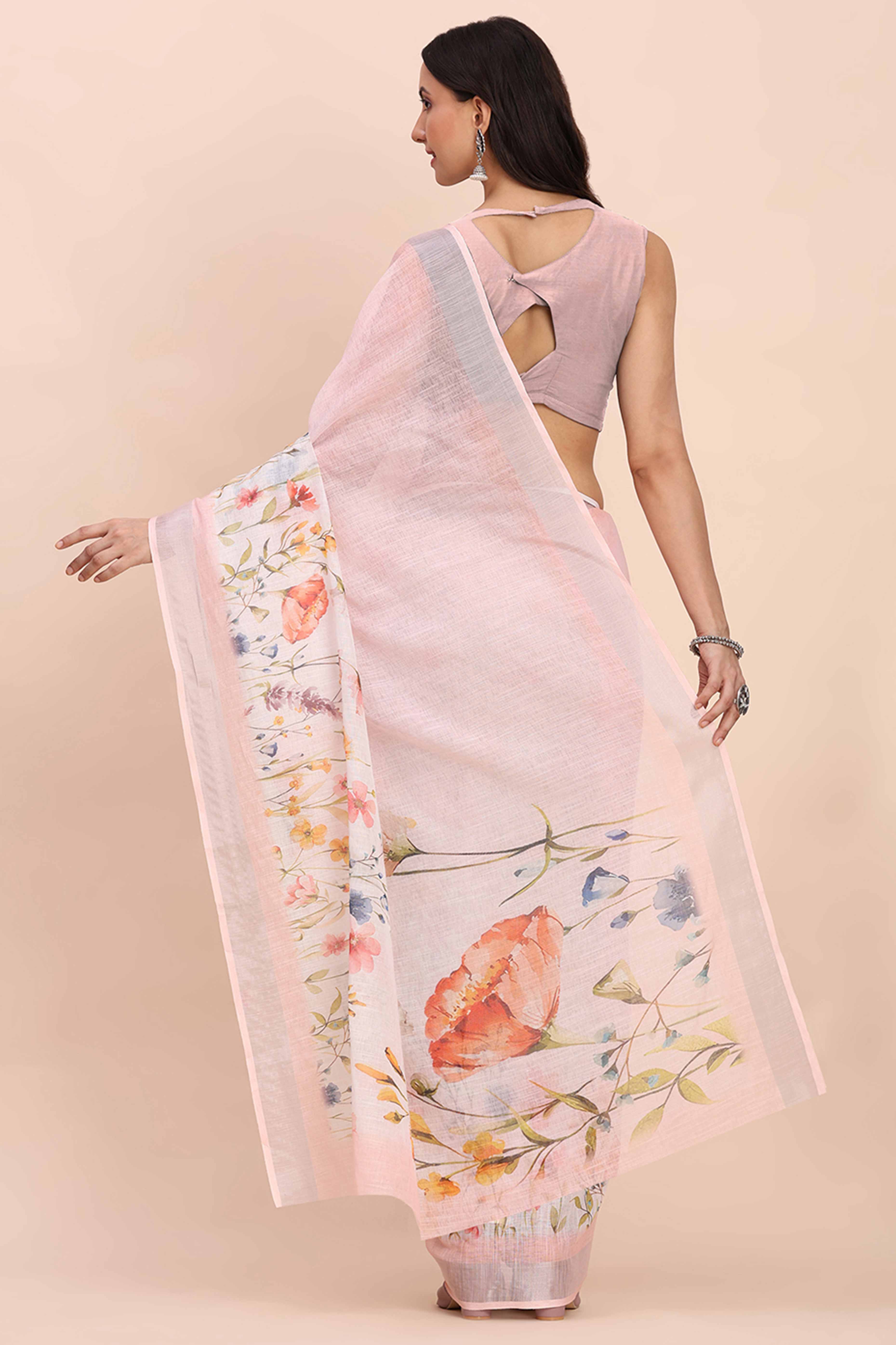 Light Pink Linen Cotton Saree Featuring Floral Prints & Woven Border