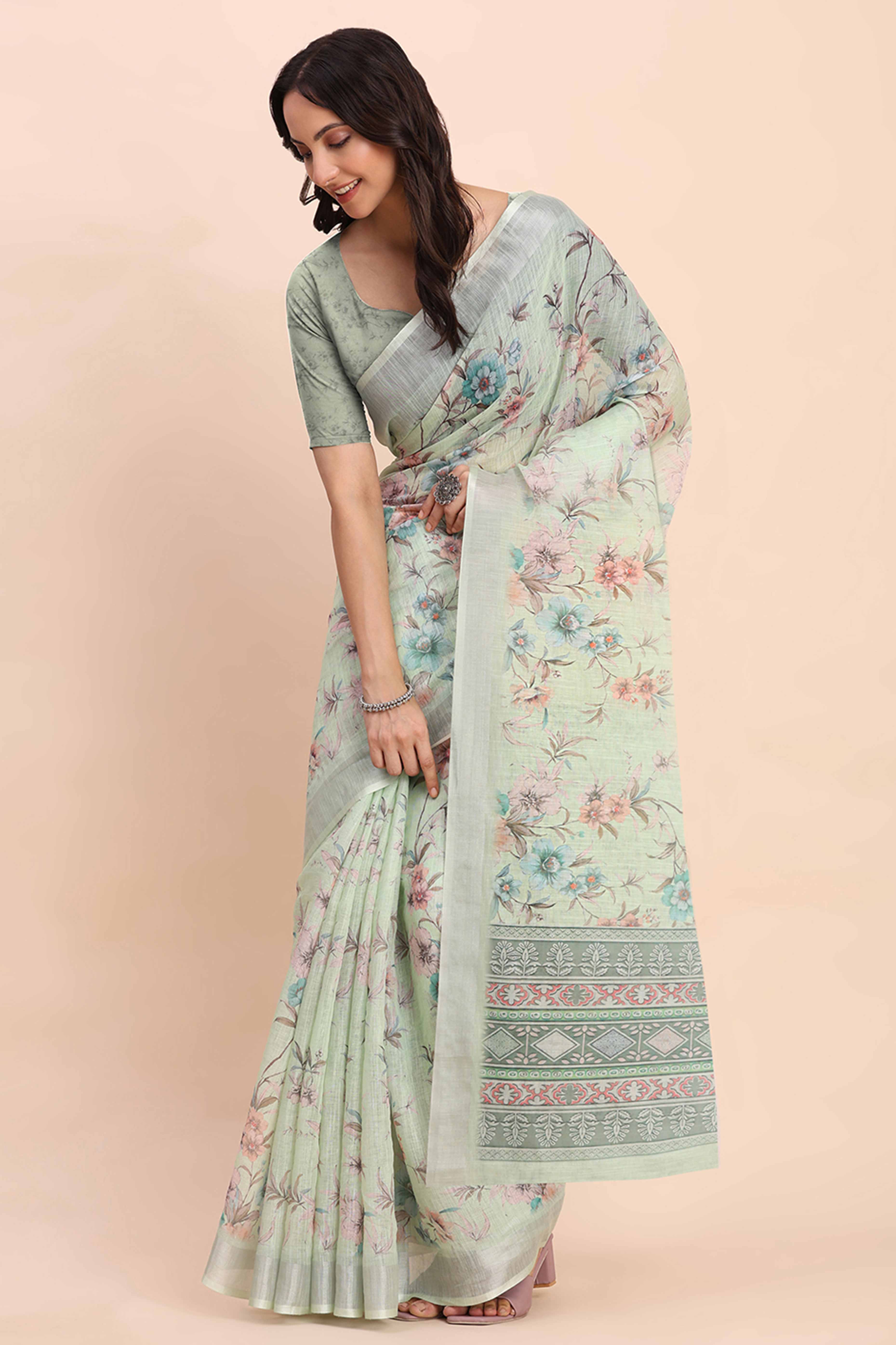 Light Green Linen Cotton Saree Featuring Floral Prints & Woven Border