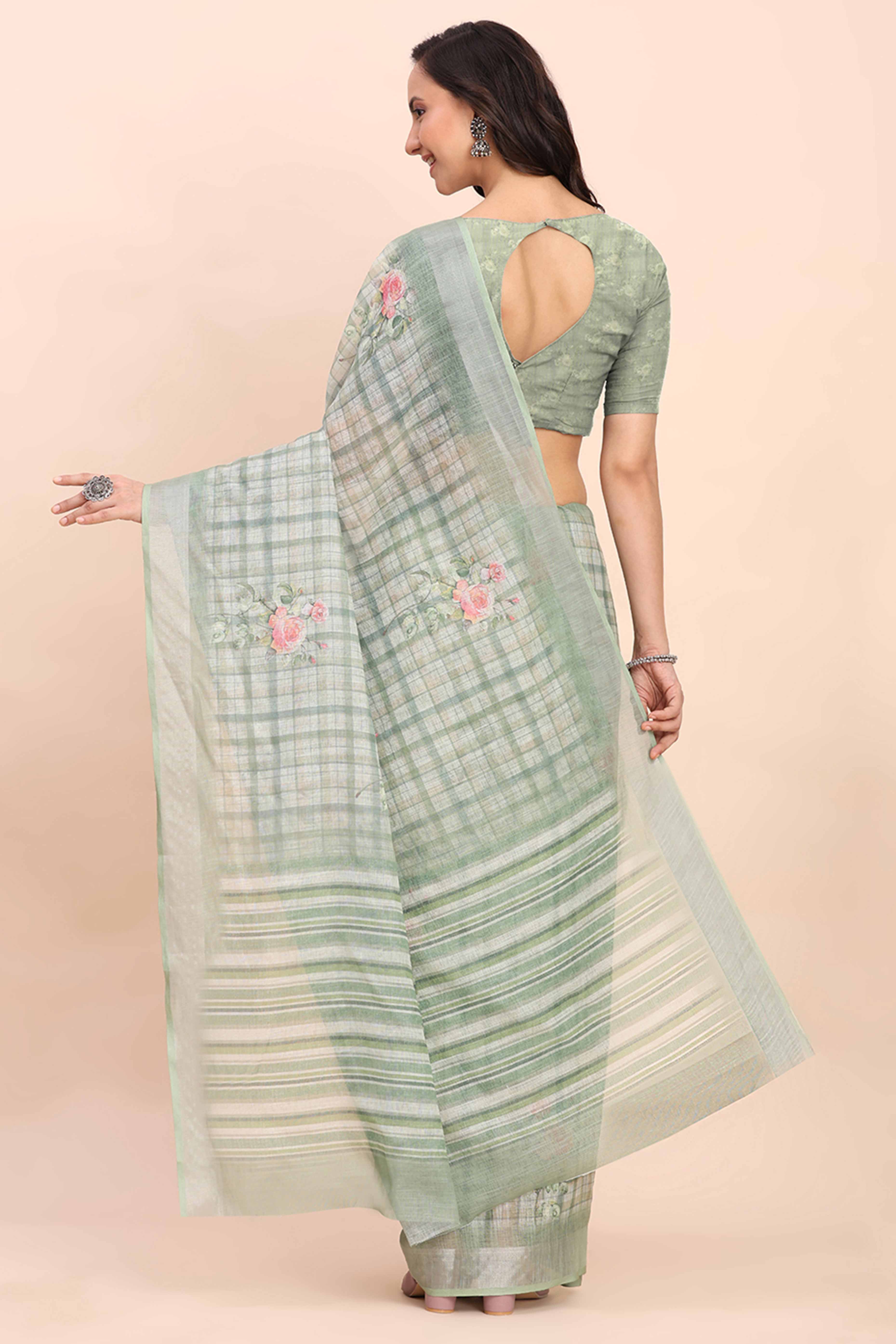 Sea Green Linen Cotton Saree Featuring Floral Prints & Woven Border
