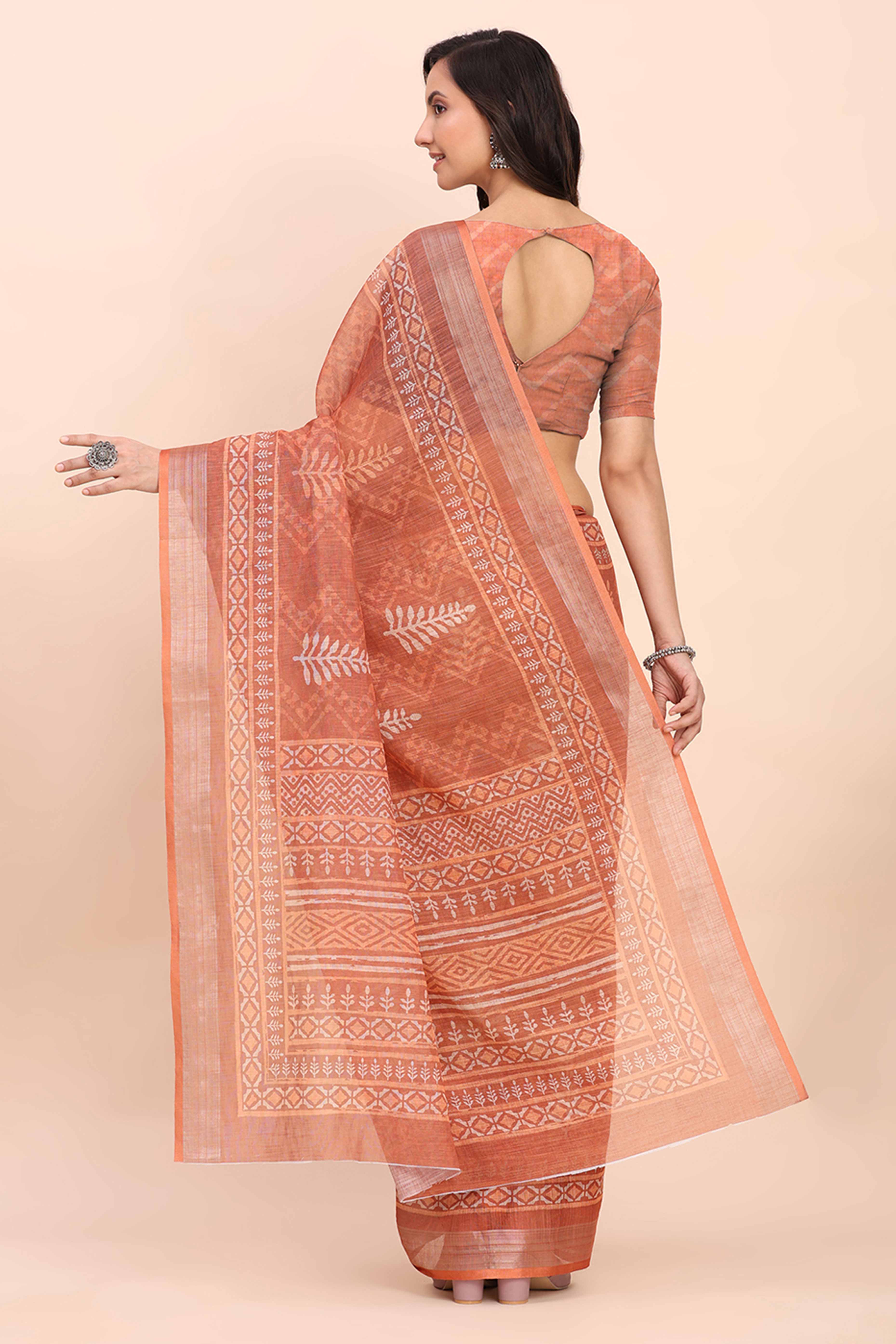 Rust Linen Saree with Intricate Silver Weaving